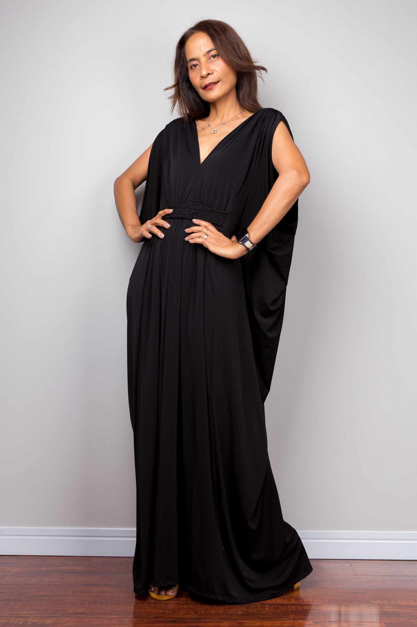 Long black caftan dress with v neck and braided detail on the waist. Batwing sleeve dress by Nuichan