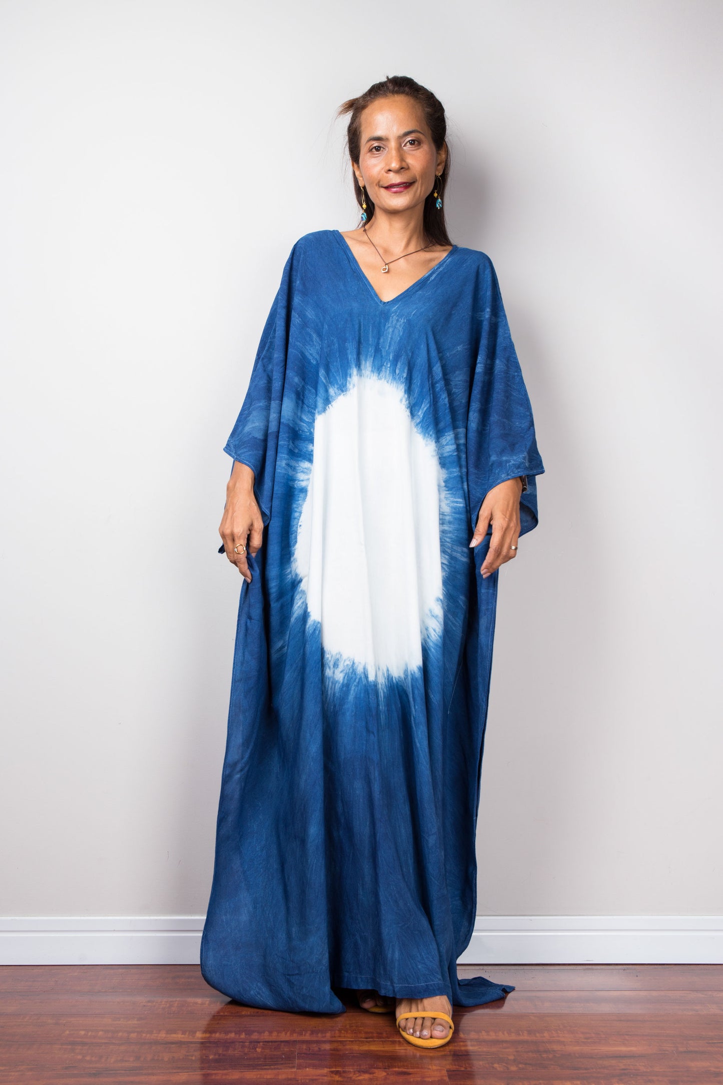 Indigo blue kaftan dress with big white circle on the front. Loose fitting caftan with v neck