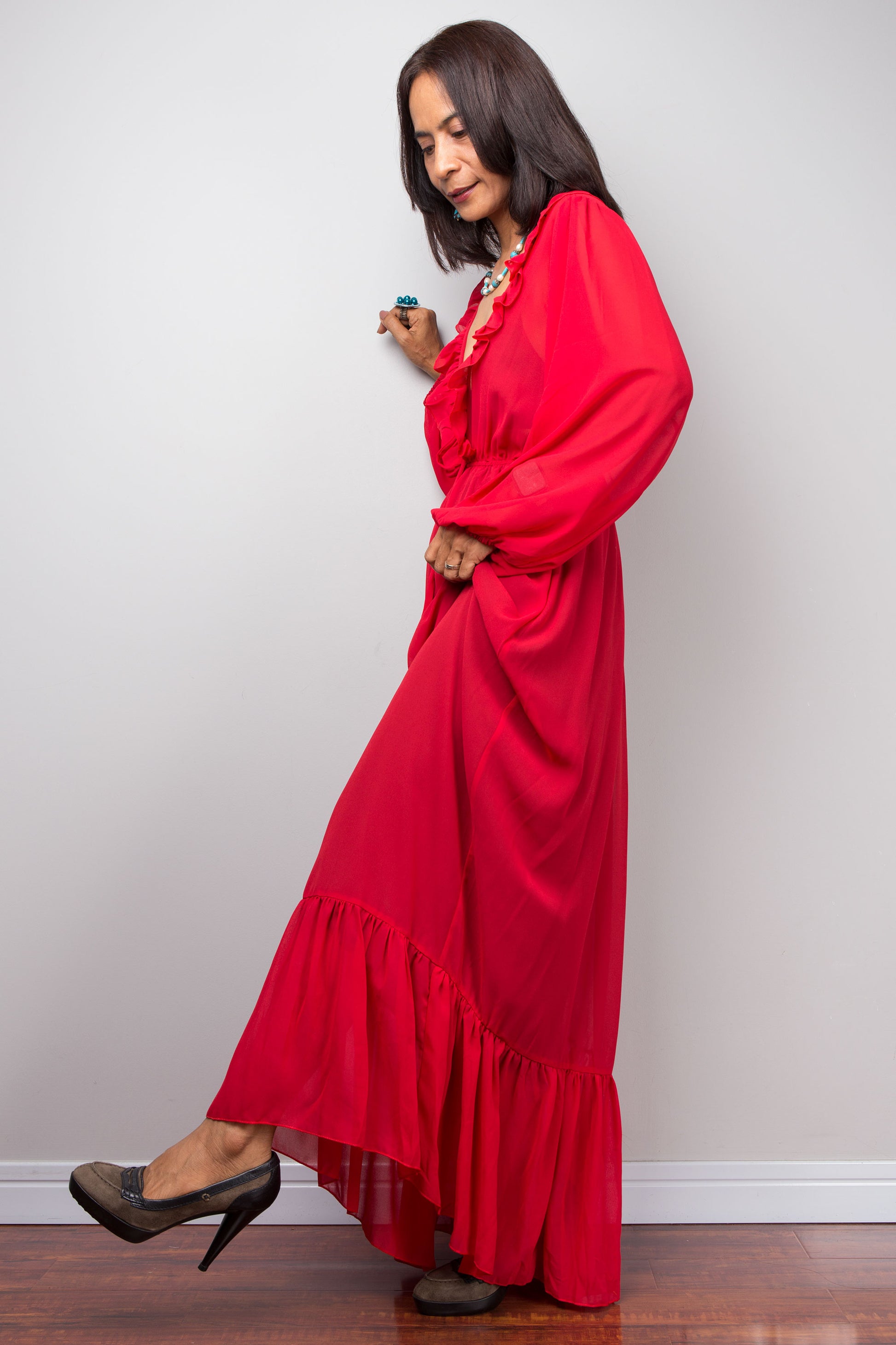Full-body shot of Nuichan Red Maxi Dress, ruffle neckline, summer style 2025.