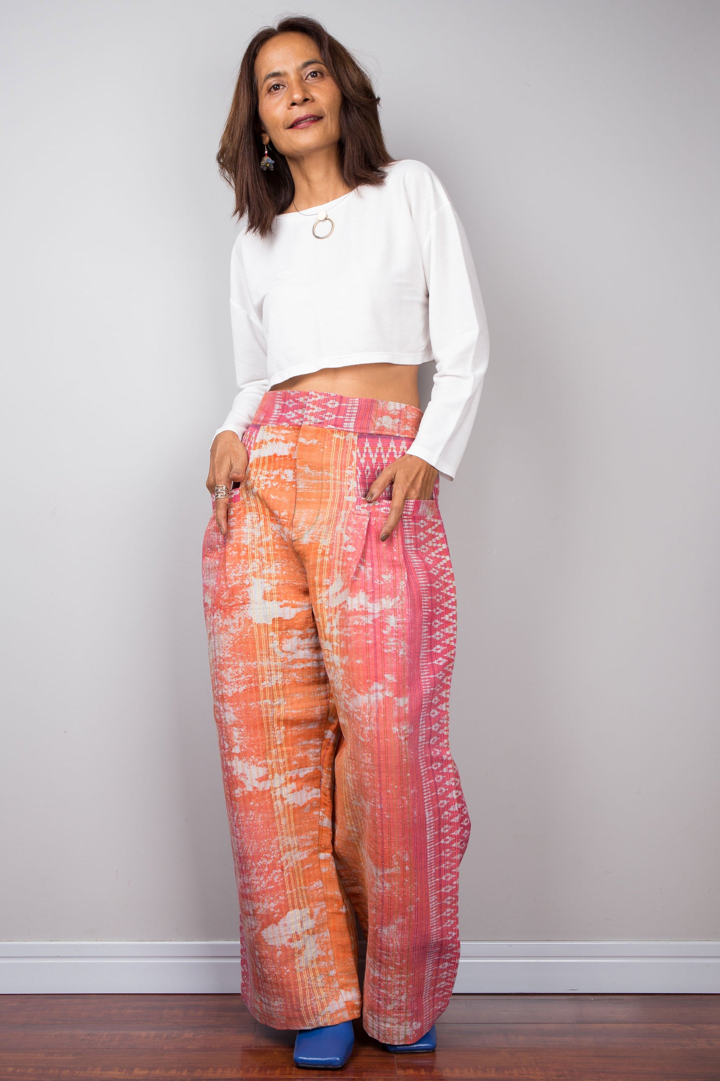 Stylish, sustainable fashion from Nuichan, featuring these vibrant pink and orange tie-dye hemp trousers, ideal for streetwear and eco-conscious shoppers.