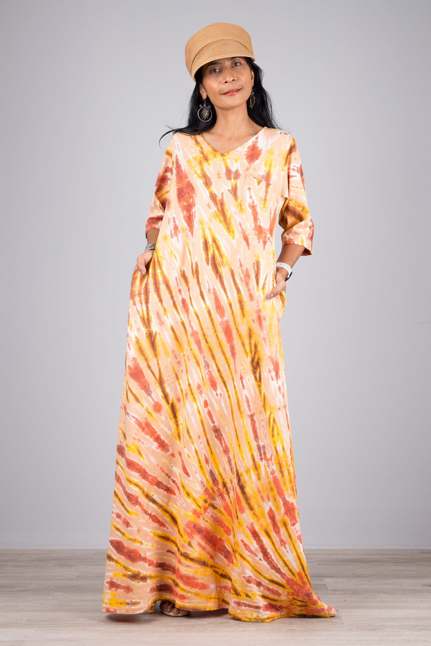 Orange tie dye dress with mid length sleeves and pocket