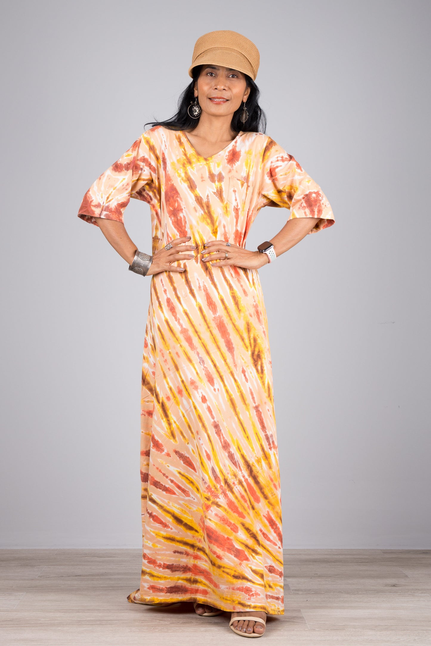 Tie dye maxi dress with mid-length sleeves. Mostly orange tie dye.