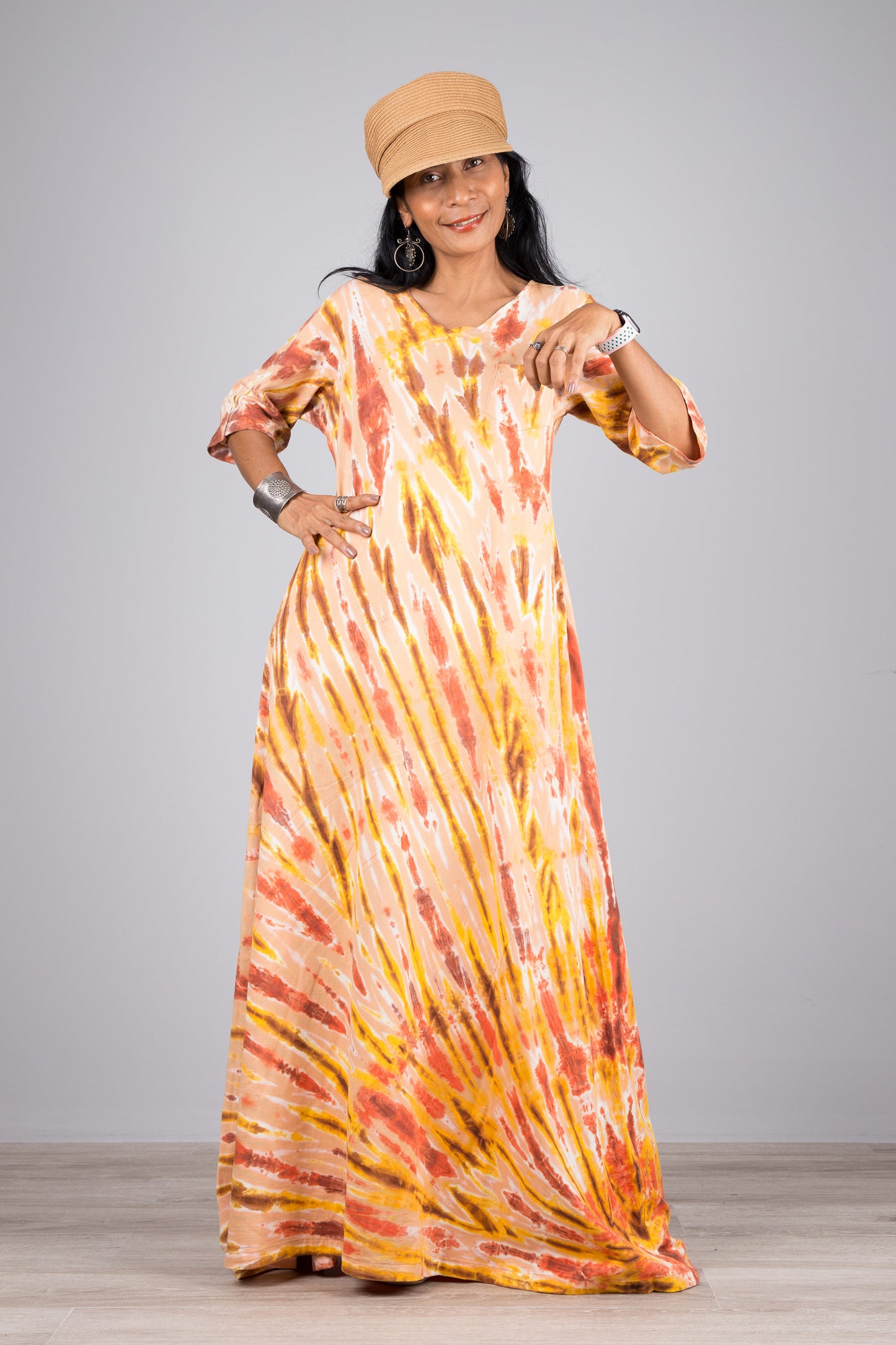 Tied dye maxi dress with mid length sleeves. Orange tie dye dress