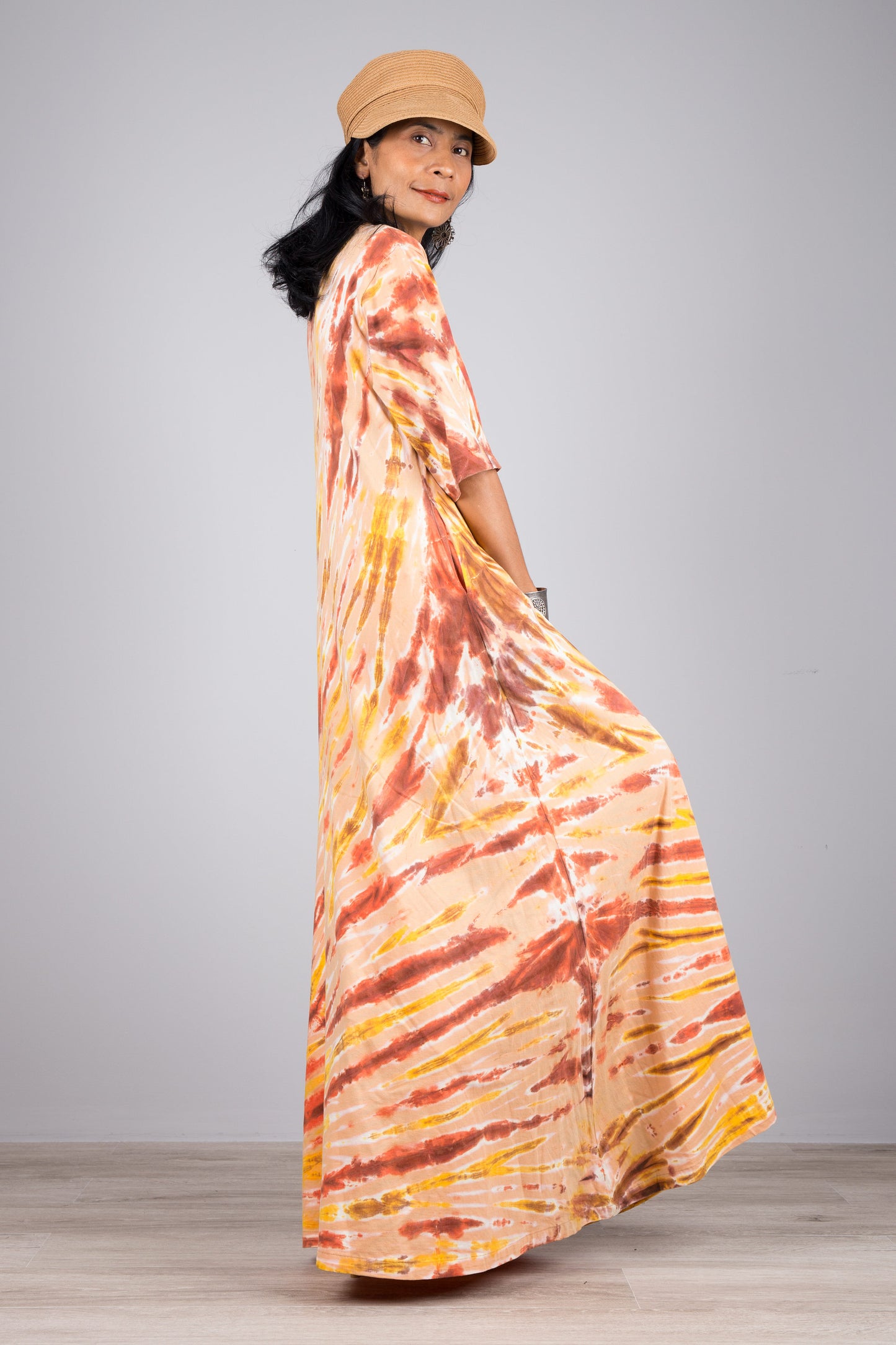 Tie dye dress in orange. Maxi dress style with mid length sleeves. Nuichan tie dye