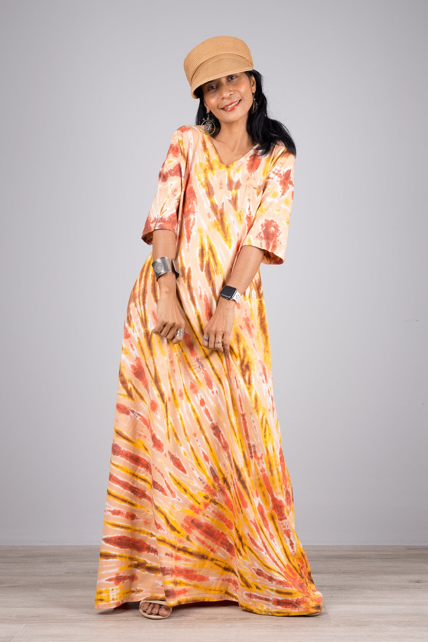 Tie dye maxi dress in orange. Hippie dress style with mid length sleeves