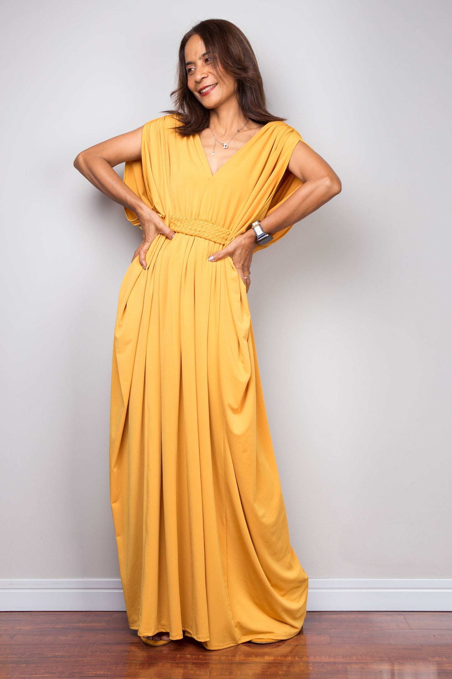 Yellow kaftan maxi dress with braided waist detail and v neck. Batwing sleeve design - frontal view