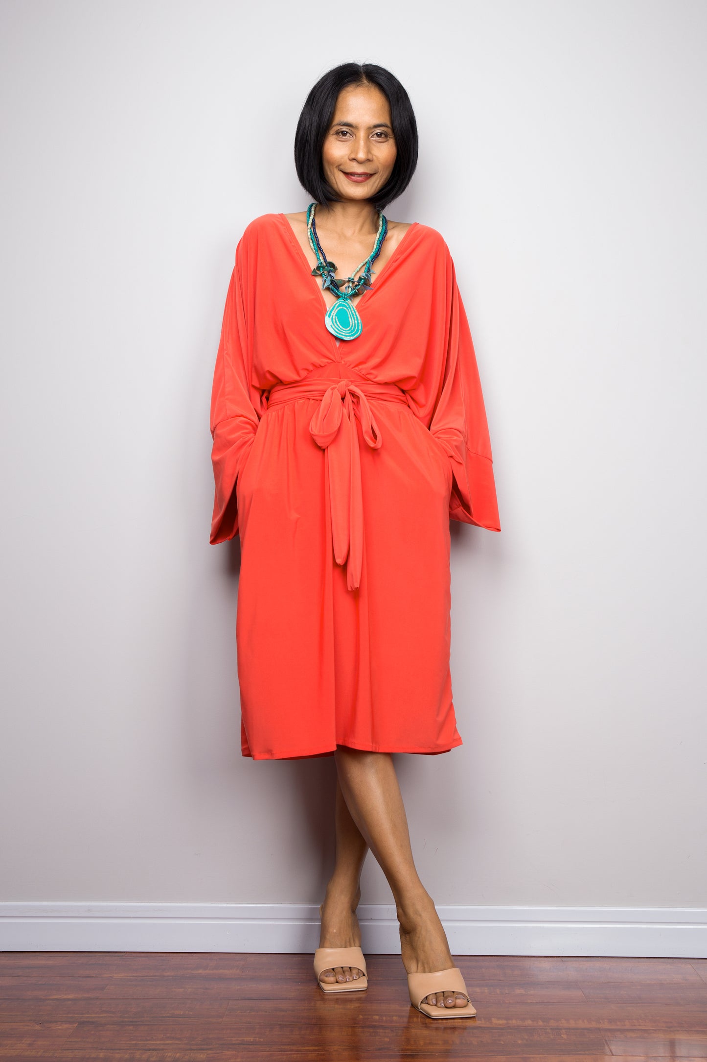 Buy elegant short orange dress online. Dress with pockets and long sleeves by Nuichan