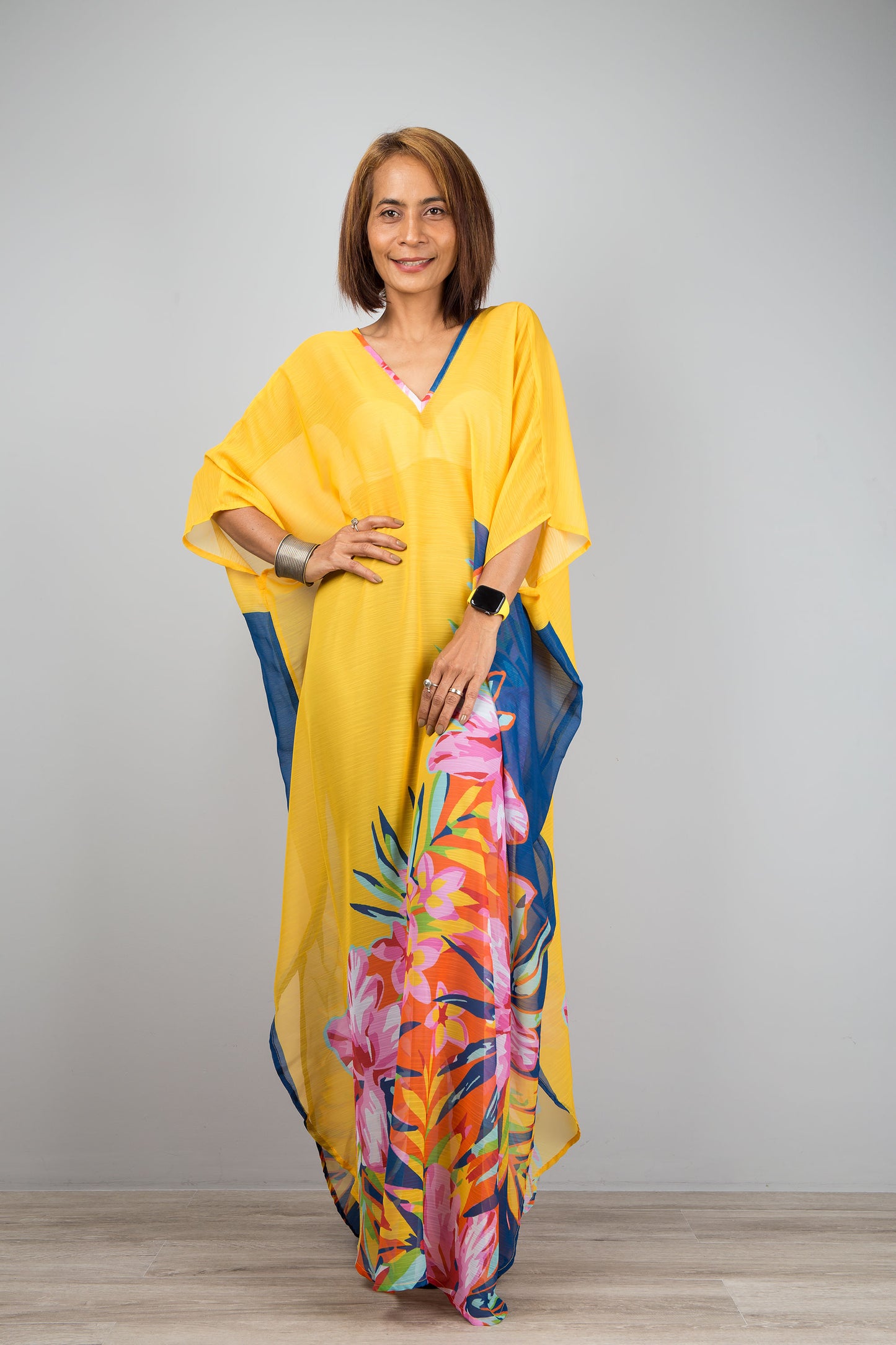 Yellow chiffon kaftan maxi dress with v neck. See through beach dress with big floral print on the side. Design by Nuichan