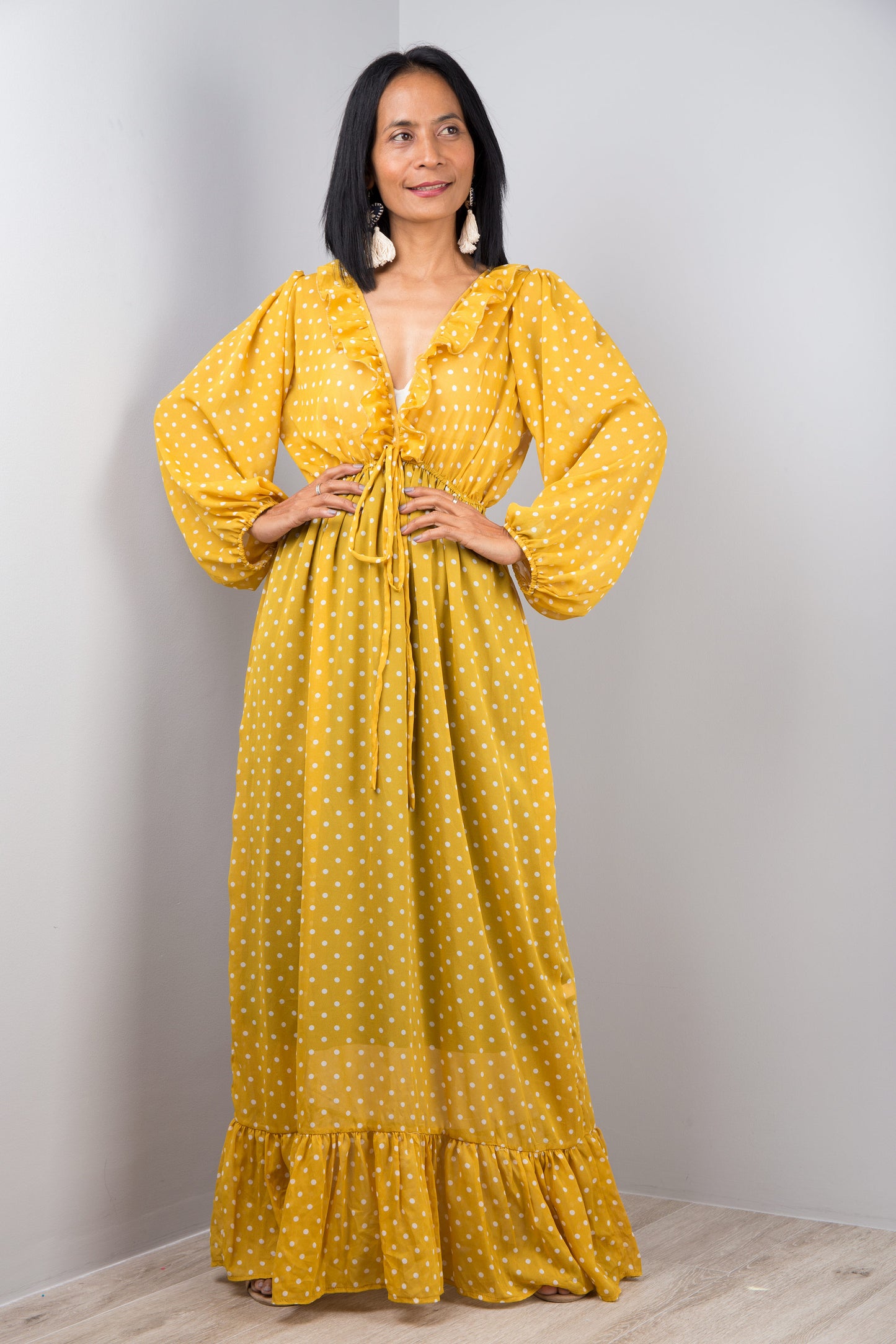 Yellow chiffon dress with plunging neckline. Ruffle on the bottom hem and drawstring at the waist