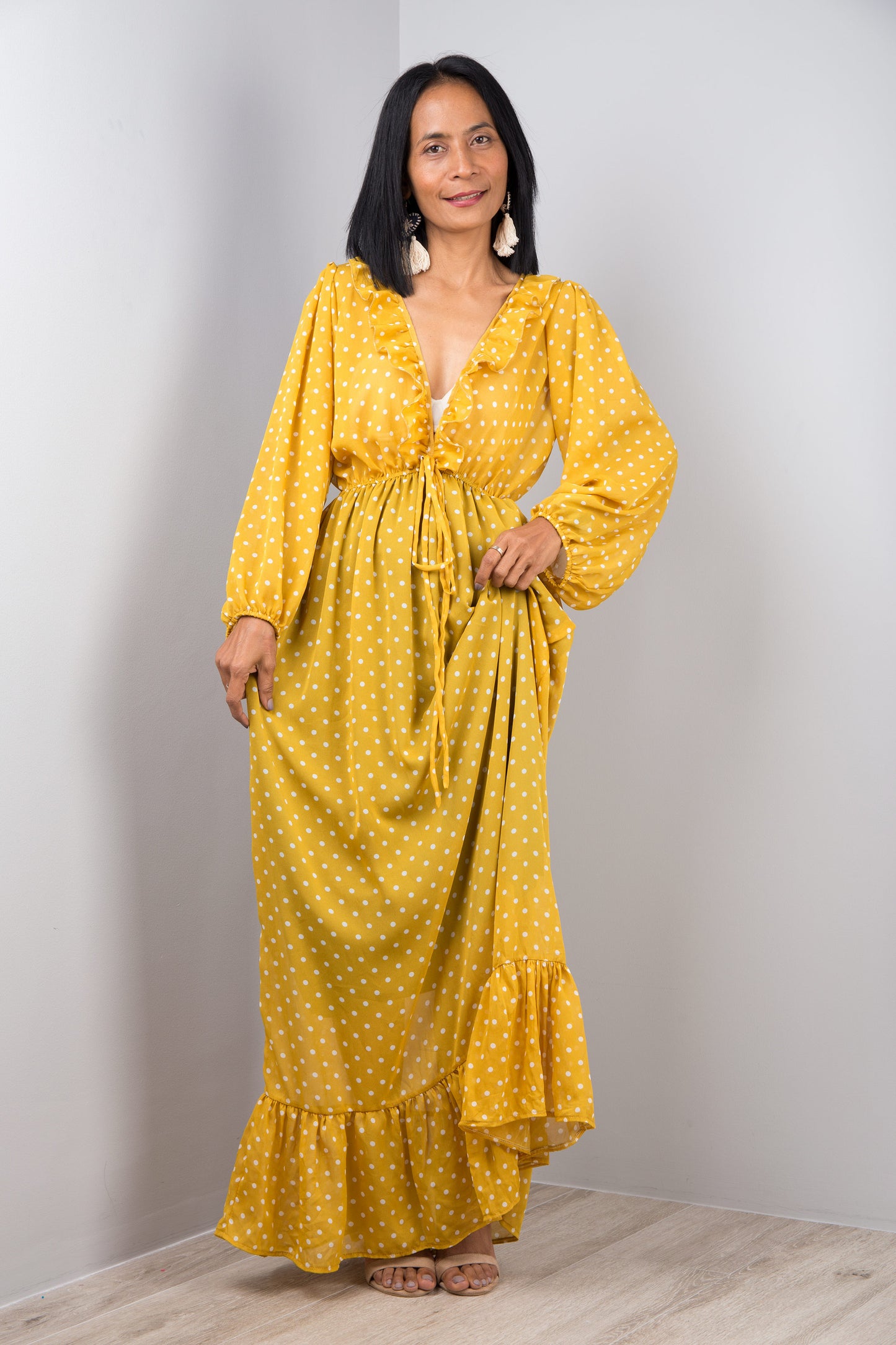 Yellow chiffon maxi dress with ruffle at the bottom hem. Polka dot print