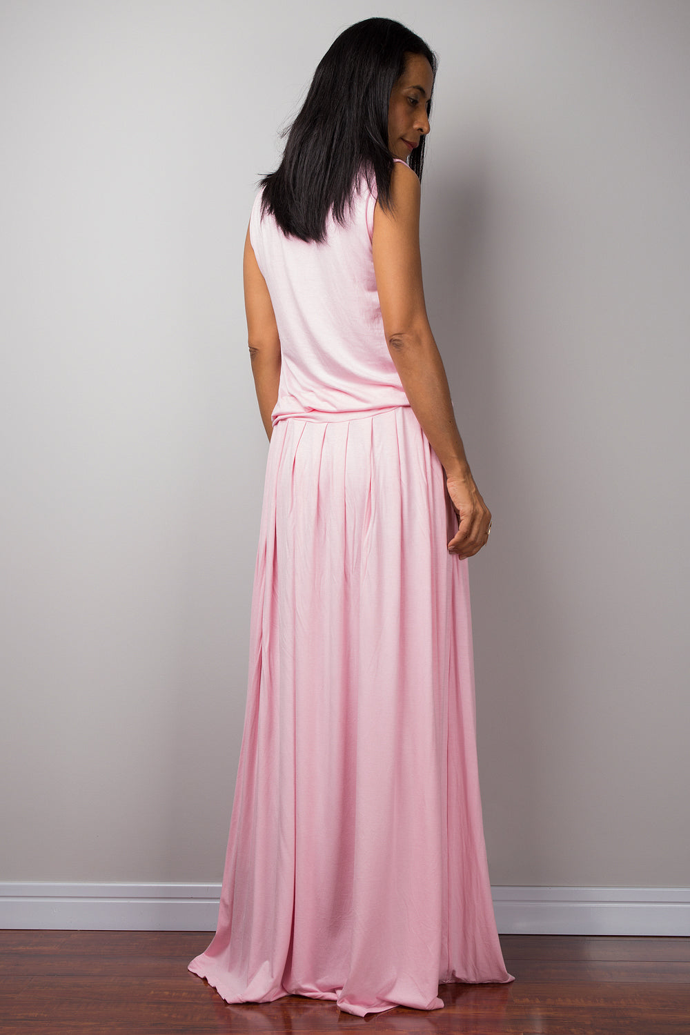Baby pink sleeveless dress with high waist pleated skirt and pockets on each side. A soft pink lounge dress by Nuichan