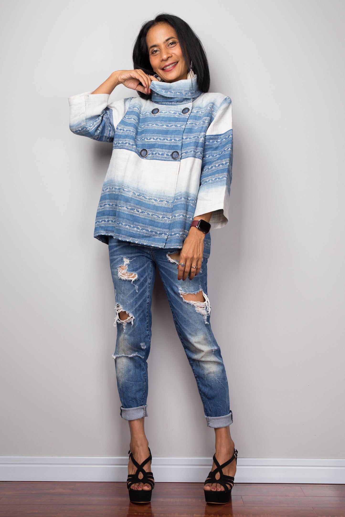 eco-friendly hemp blouse with a geometric pattern, emphasizing the handwoven texture and indigo color palette.