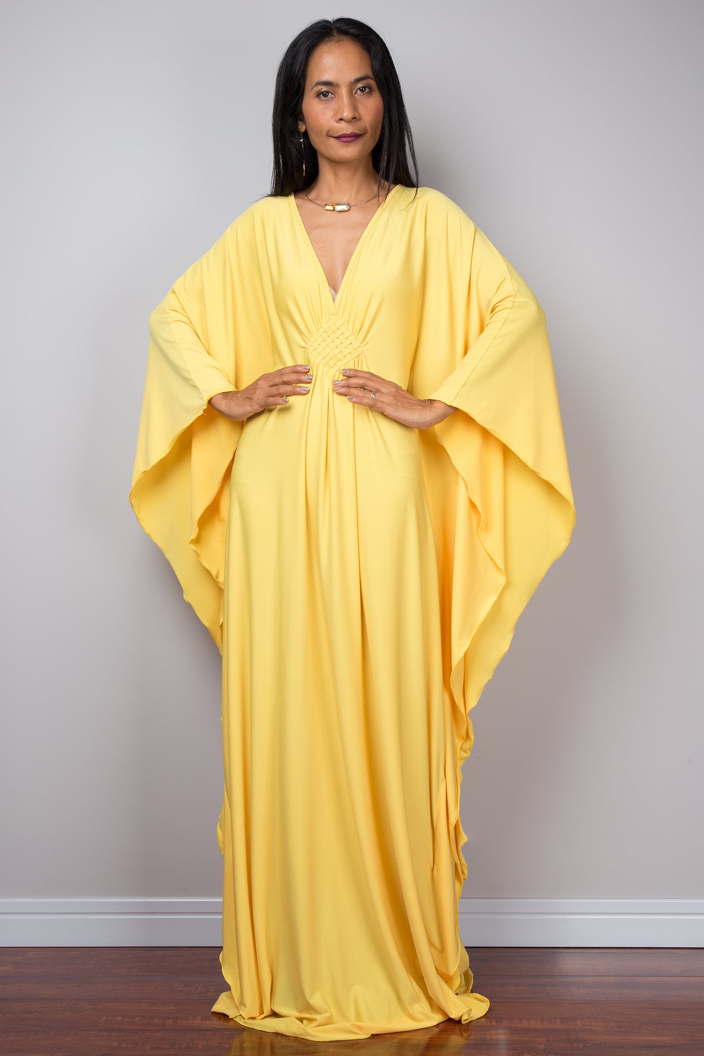 Yellow kaftan dress. Large loose fit dress with plunging neckline in a soft yellow solid fabric. A wide sleeve oversized maxi dress by Nuichan.