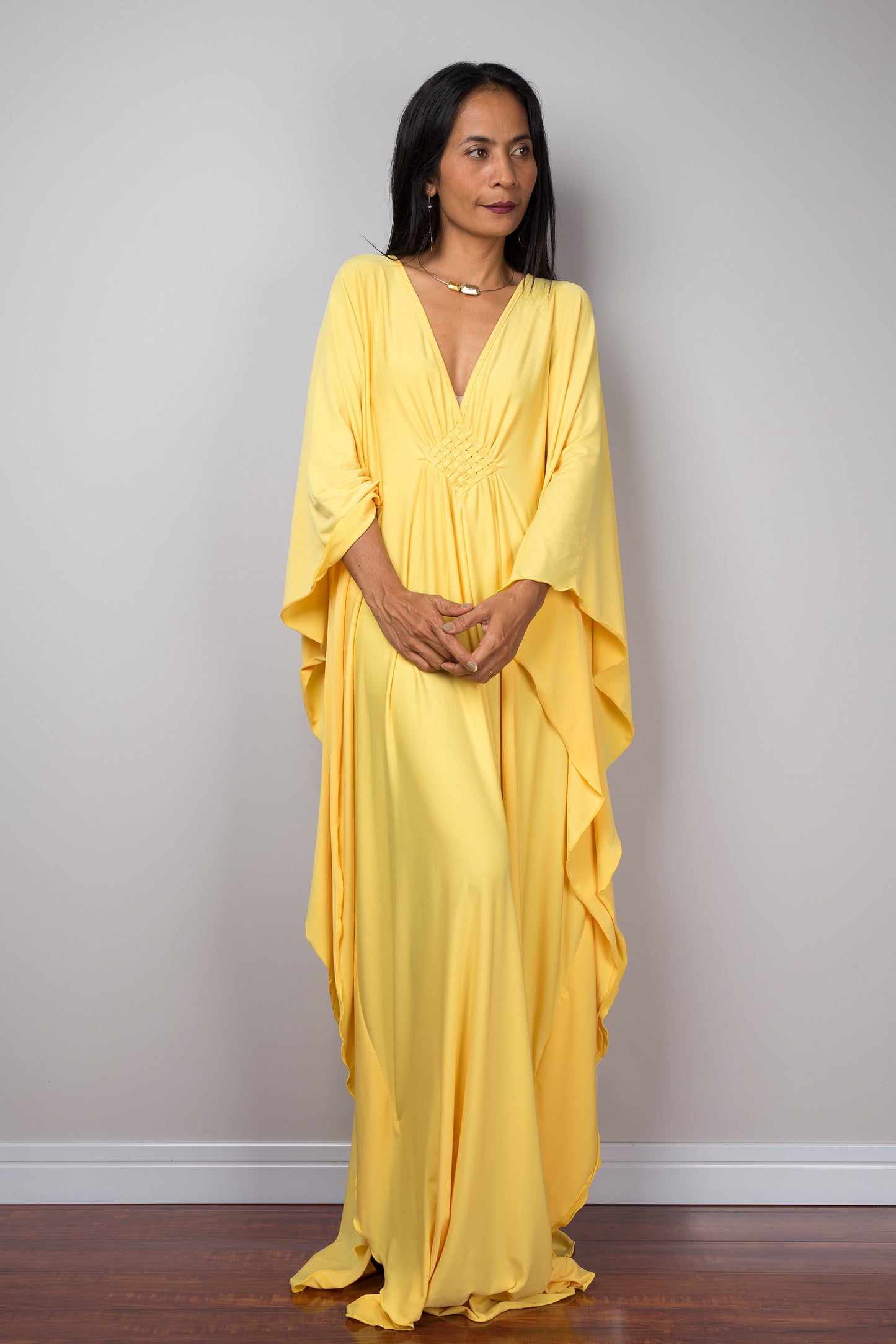 Yellow kaftan dress. Large loose fit dress with plunging neckline in a soft yellow solid fabric. A wide sleeve oversized maxi dress by Nuichan.