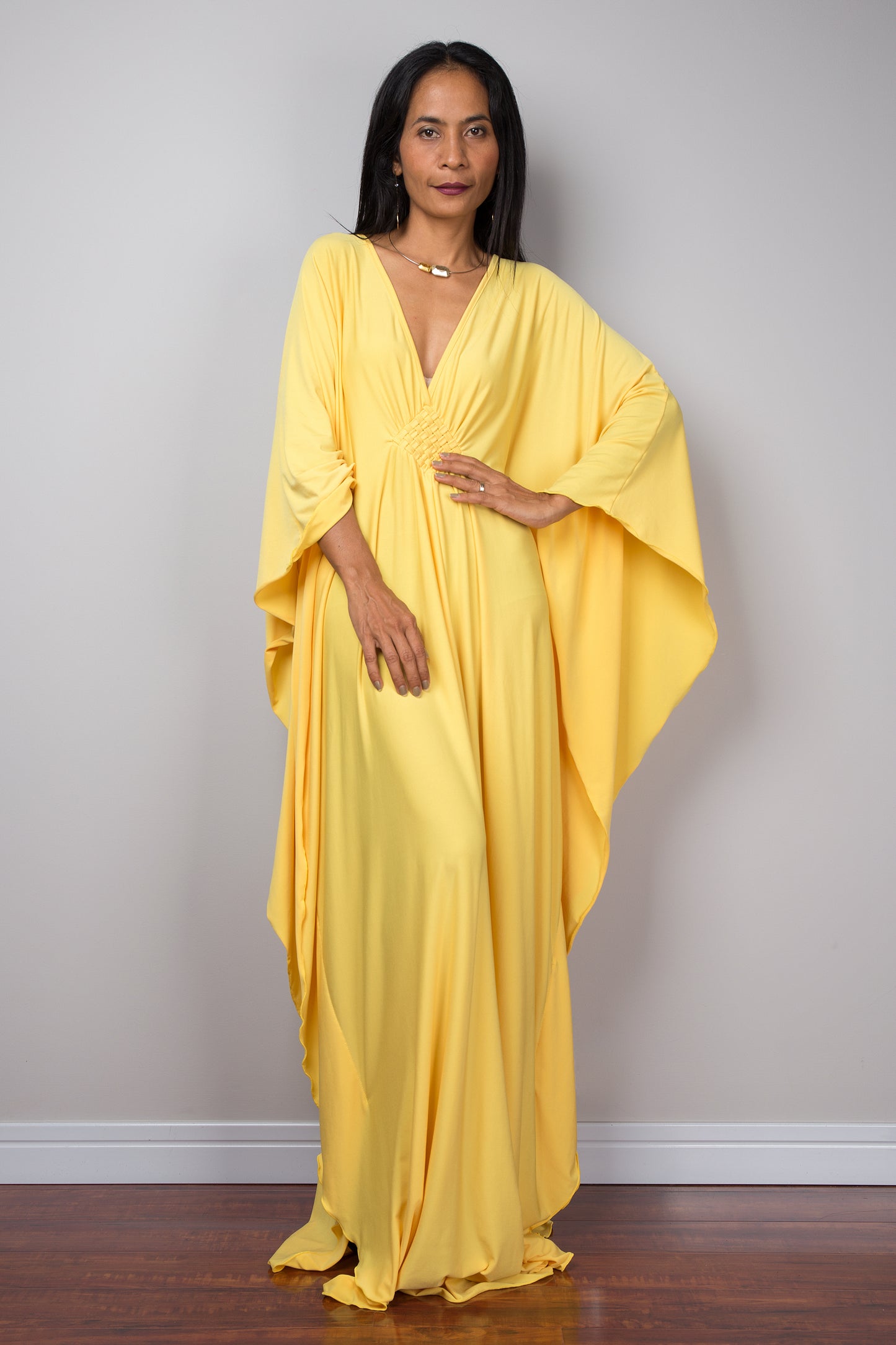Yellow kaftan dress. Large loose fit dress with plunging neckline in a soft yellow solid fabric. A wide sleeve oversized maxi dress by Nuichan.