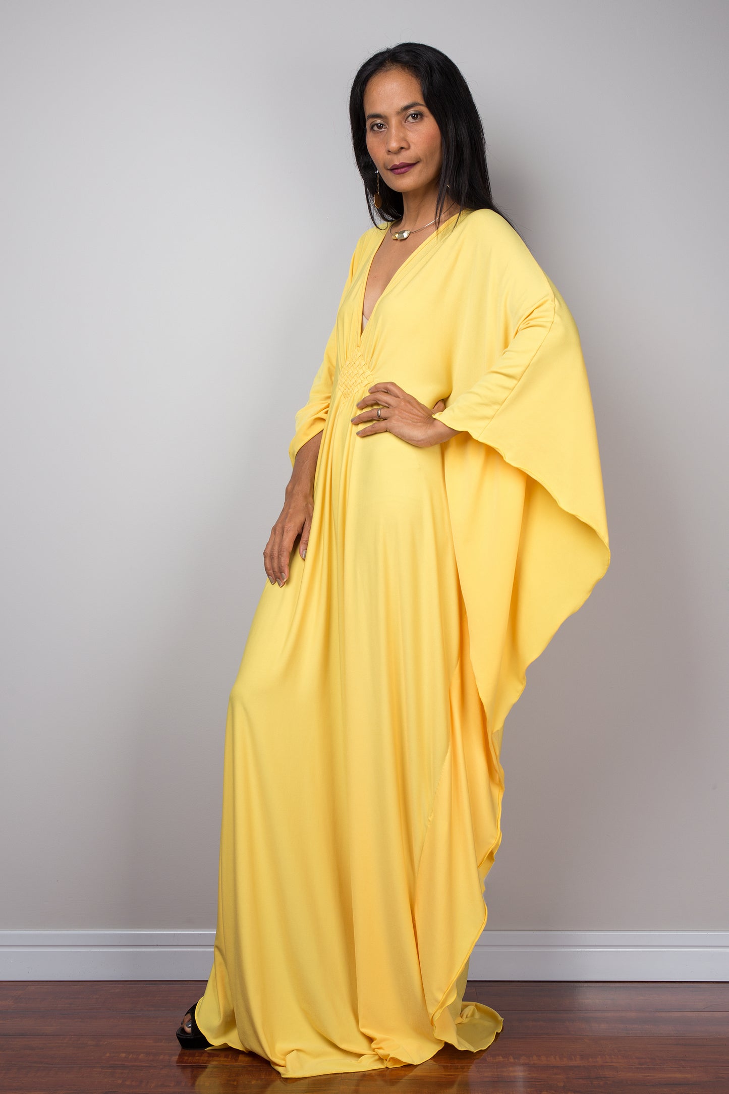 Yellow kaftan dress. Large loose fit dress with plunging neckline in a soft yellow solid fabric. A wide sleeve oversized maxi dress by Nuichan.