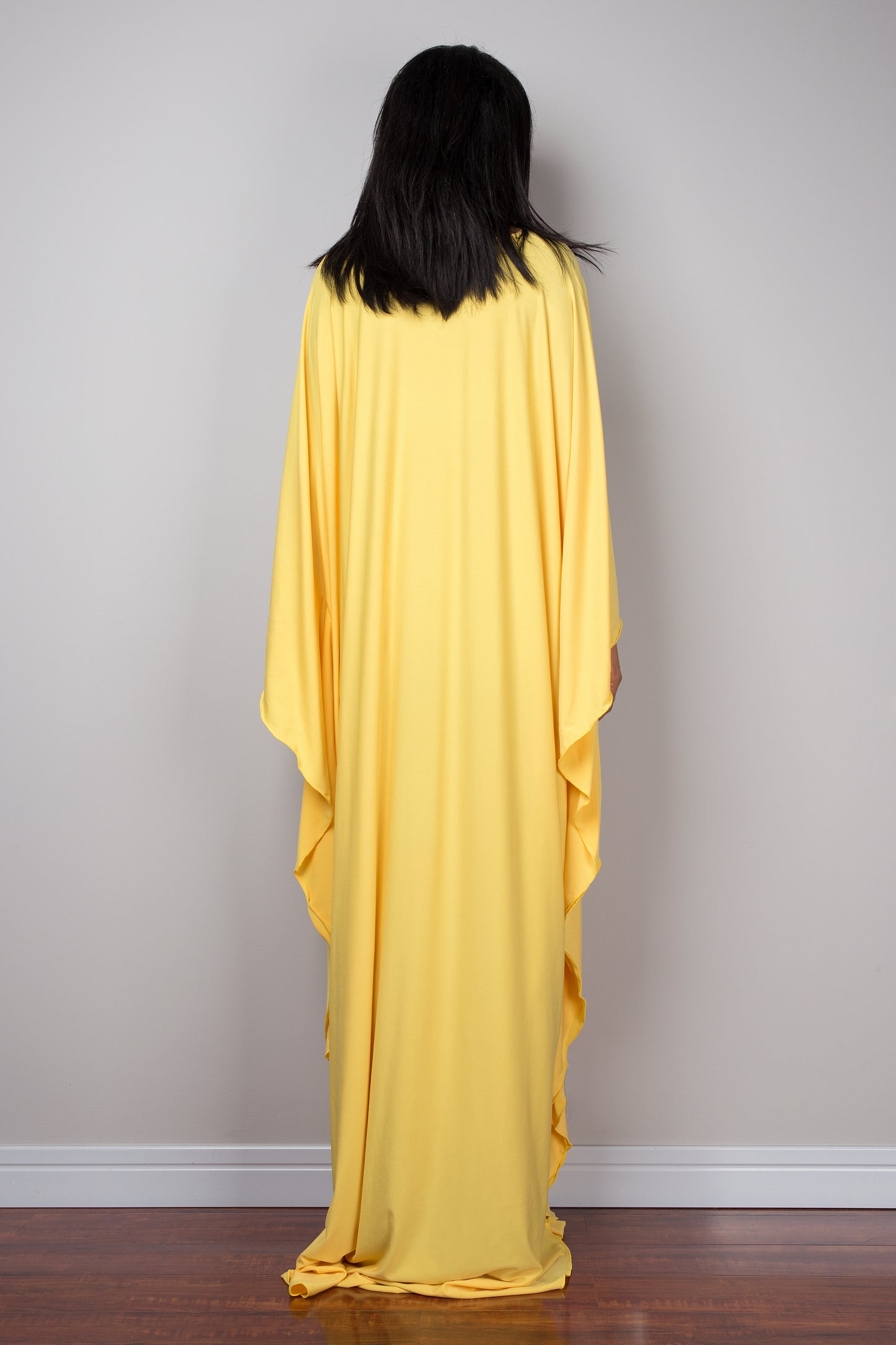 Yellow kaftan dress. Large loose fit dress with plunging neckline in a soft yellow solid fabric. A wide sleeve oversized maxi dress by Nuichan.