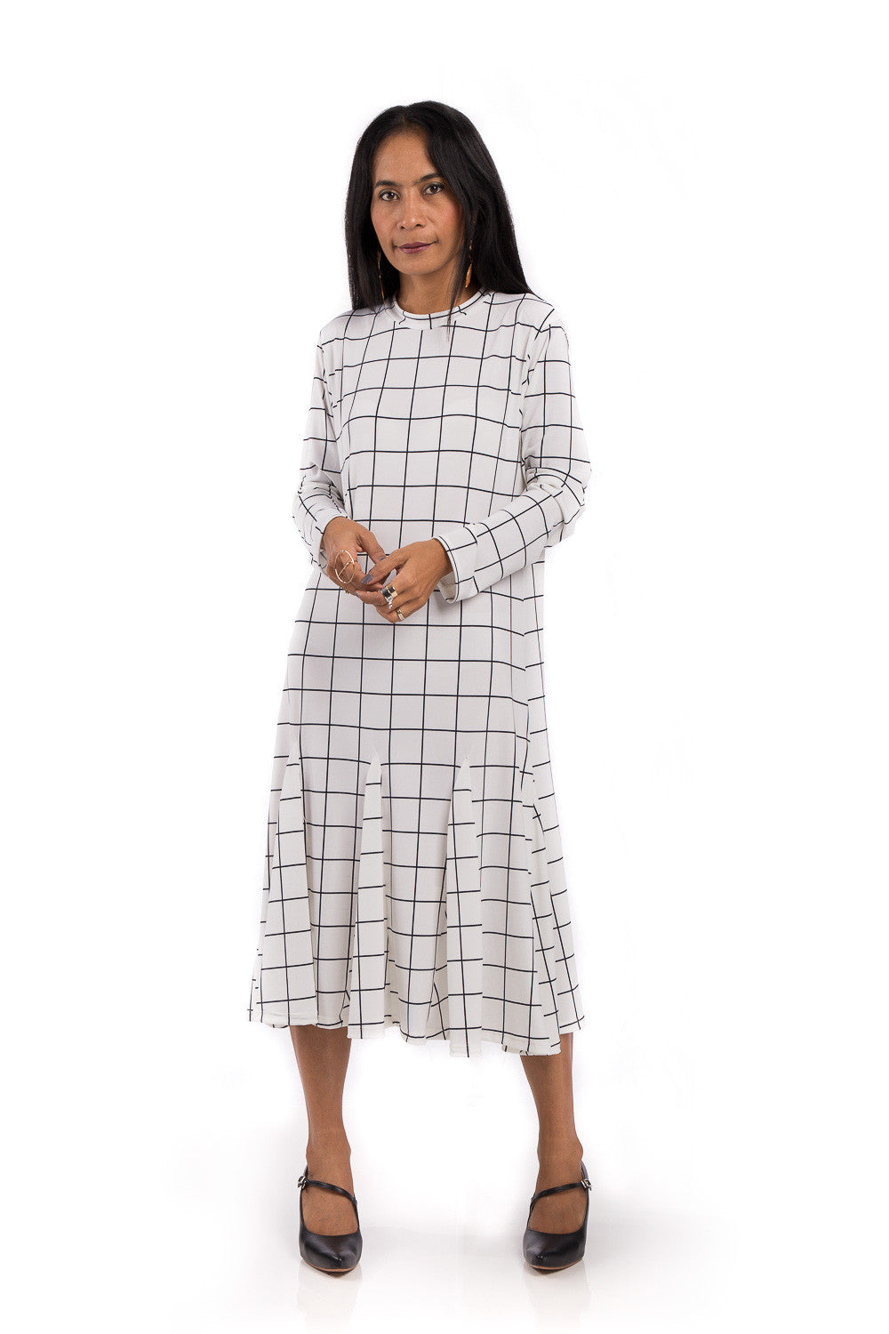 Knee length dress. White dress with black square print. Modest neckline and long sleeves. Tube dress with pleated bottom part by Nuichan.