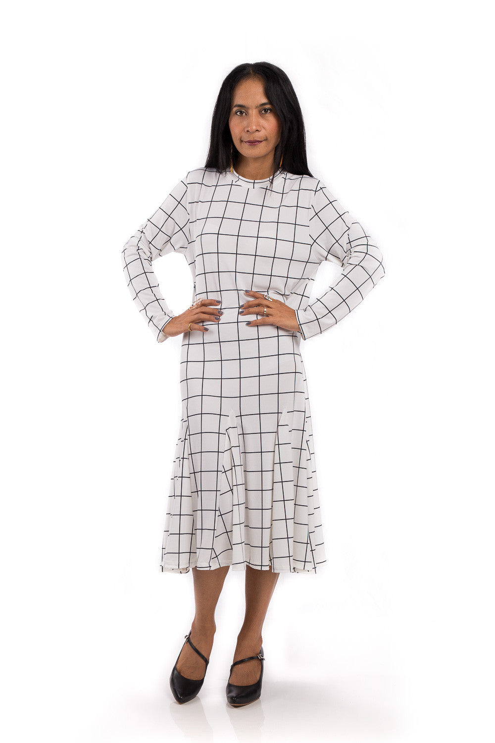 Knee length dress. White dress with black square print. Modest neckline and long sleeves. Tube dress with pleated bottom part by Nuichan.