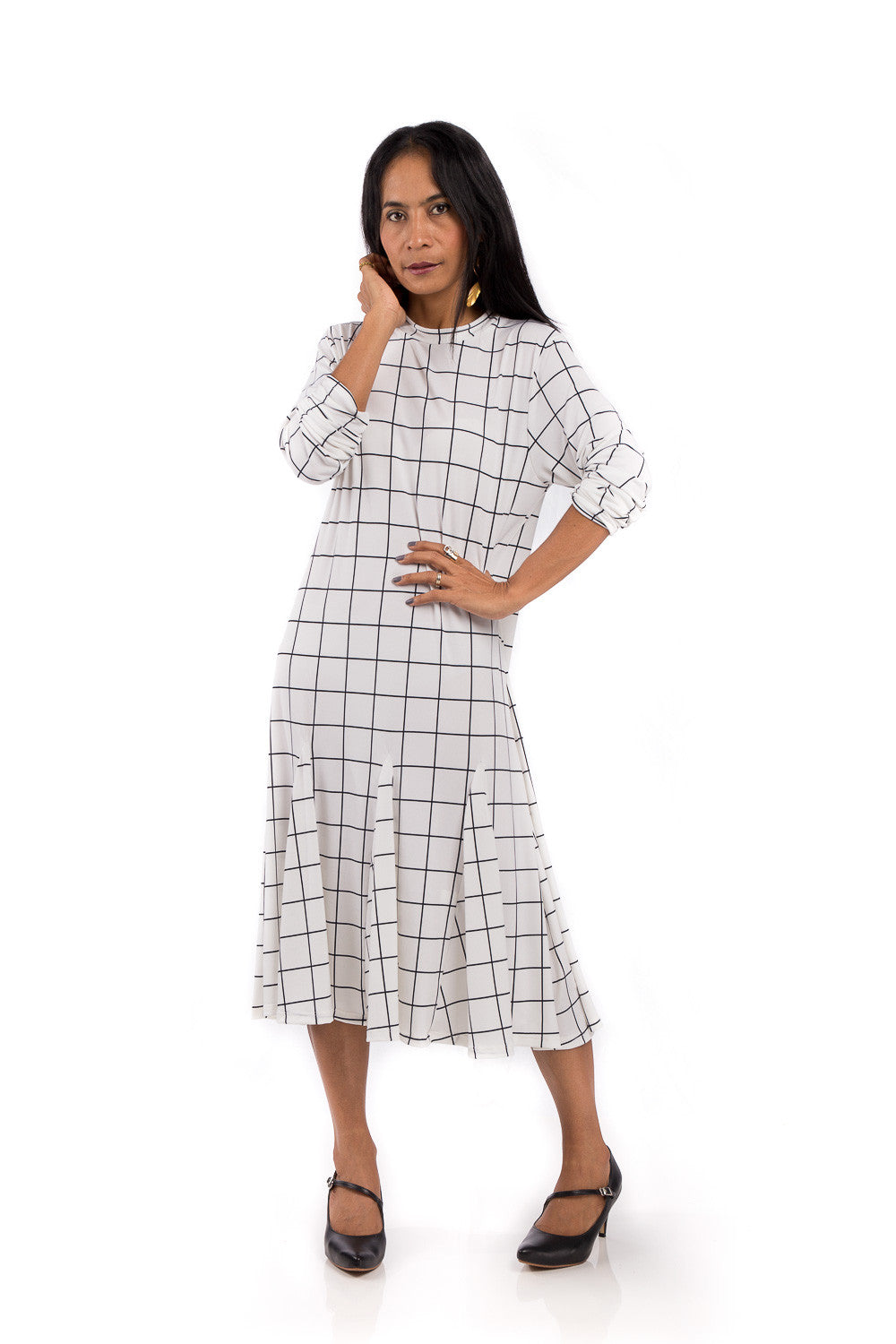 Knee length dress. White dress with black square print. Modest neckline and long sleeves. Tube dress with pleated bottom part by Nuichan.