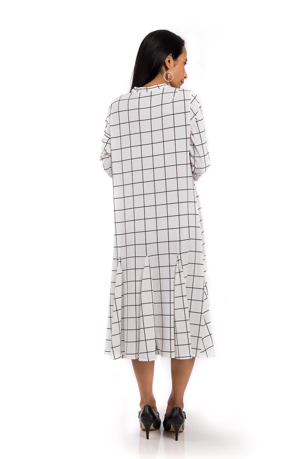 Knee length dress. White dress with black square print. Modest neckline and long sleeves. Tube dress with pleated bottom part by Nuichan.