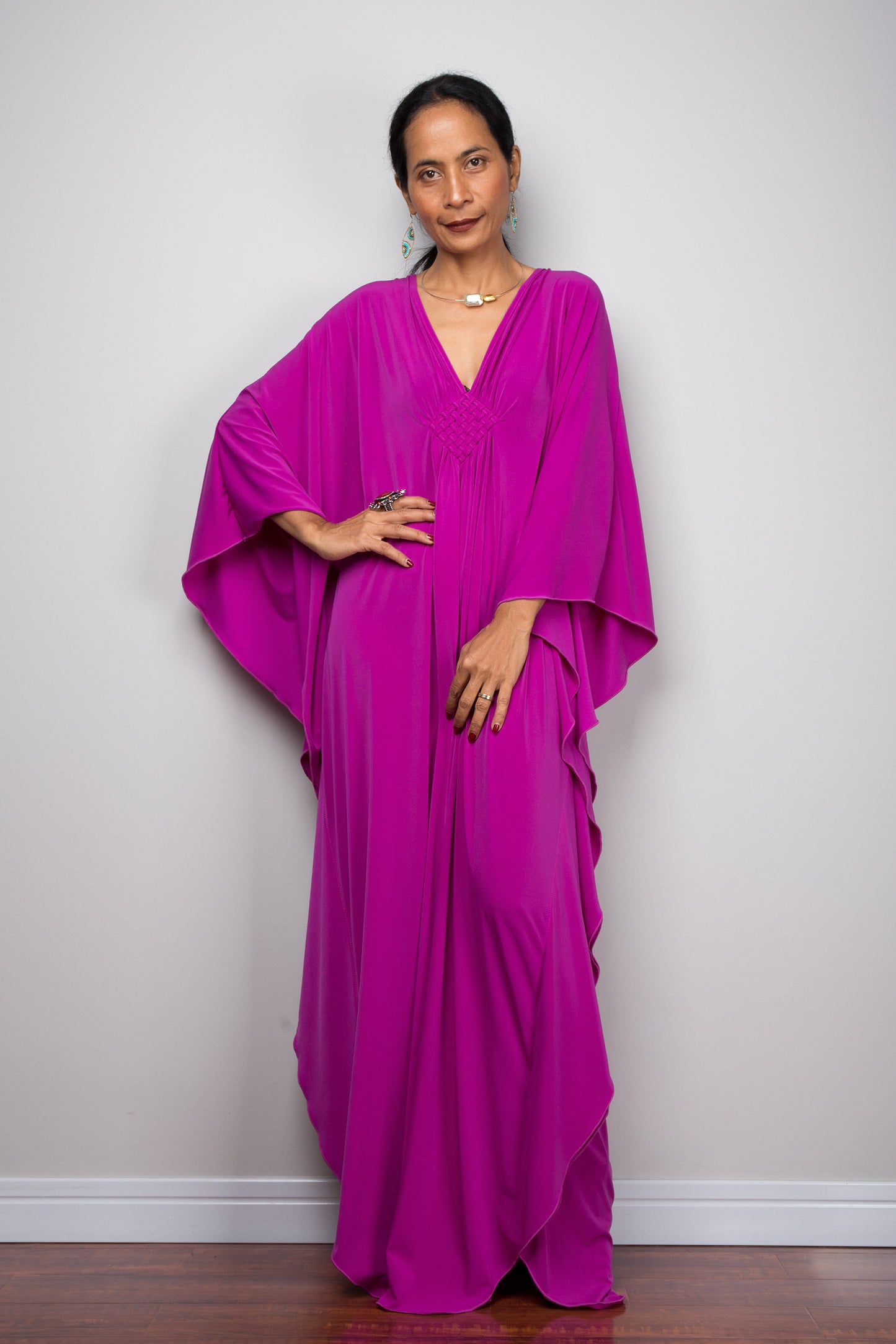 Shop for kaftan dresses online. Magenta caftan dress by Nuichan. A plus size purple kaftan dress with plunging neckline.