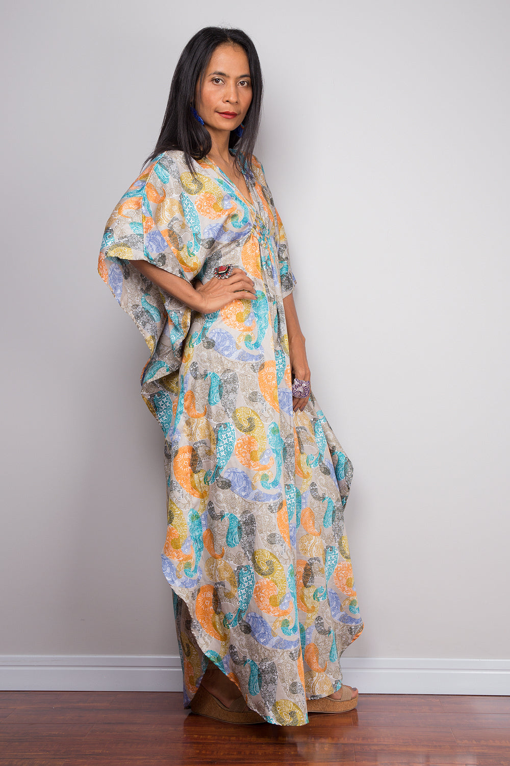 Women wearing a petite kaftan tunic dress with paisley print