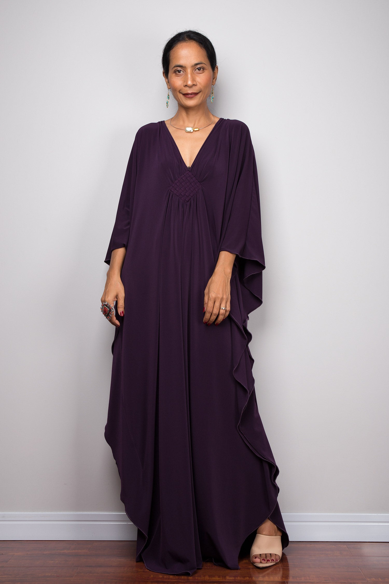 Long dark purple kaftan dress with plunging neckline