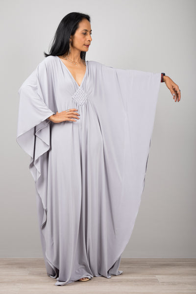Light grey kaftan dress with plunging neckline.  Diamond shape woven detail just below neckline.  A true classic toga dress by Nuichan