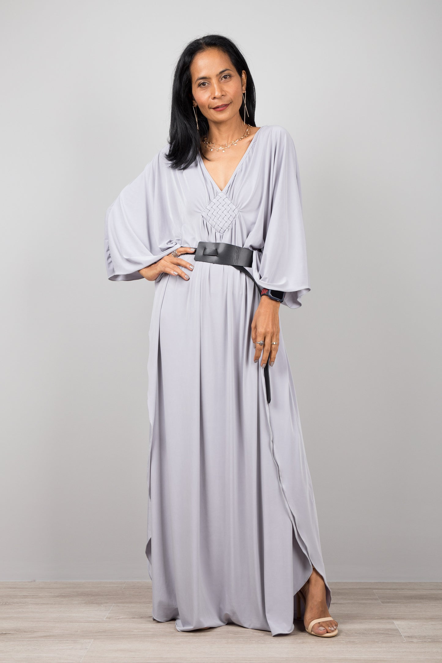 Light grey kaftan dress with plunging neckline. Diamond shape woven detail just below neckline. A true classic toga dress by Nuichan
