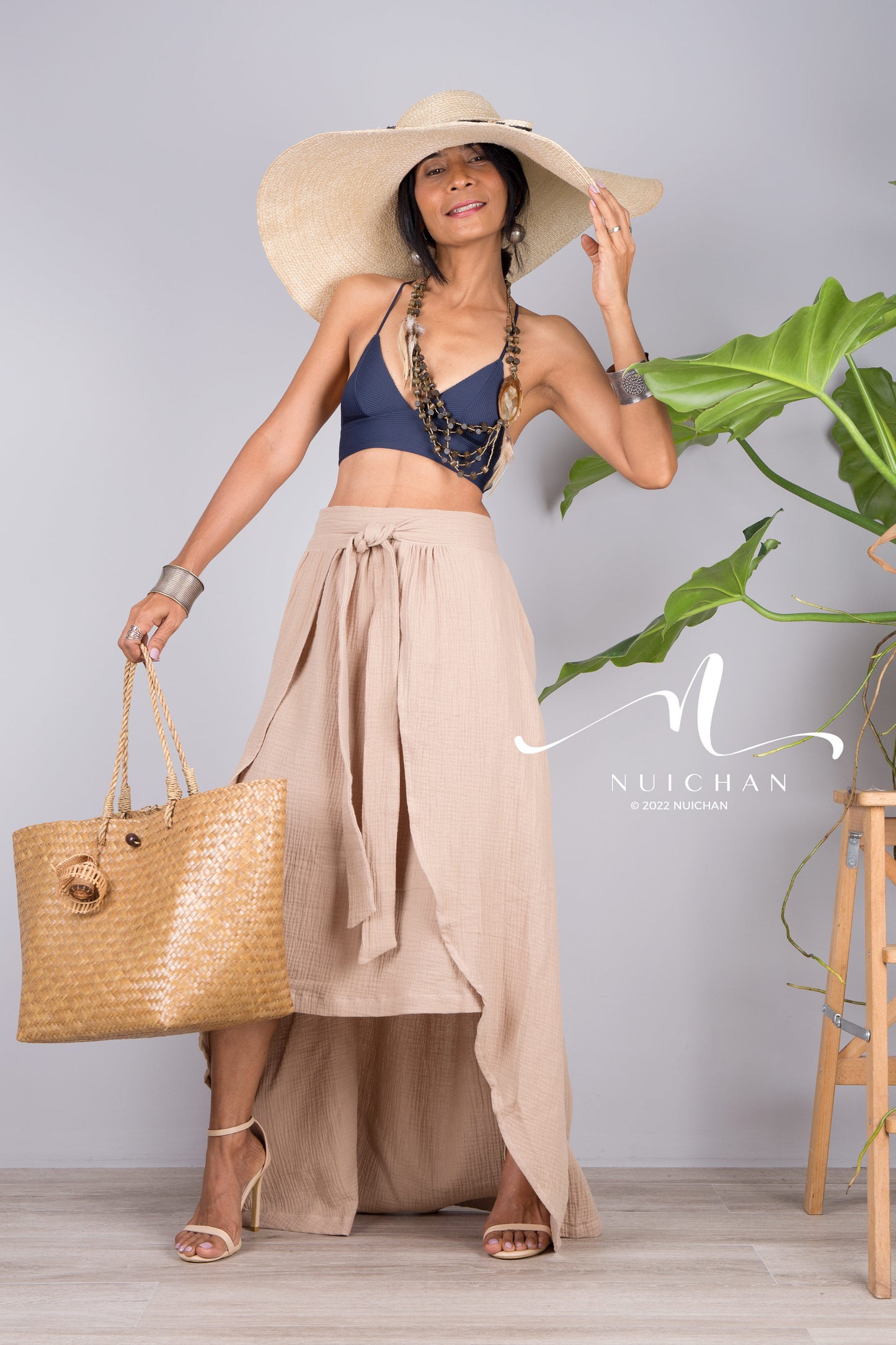 Cotton wrap skirt with asymmetrical design. Beige summer skirt