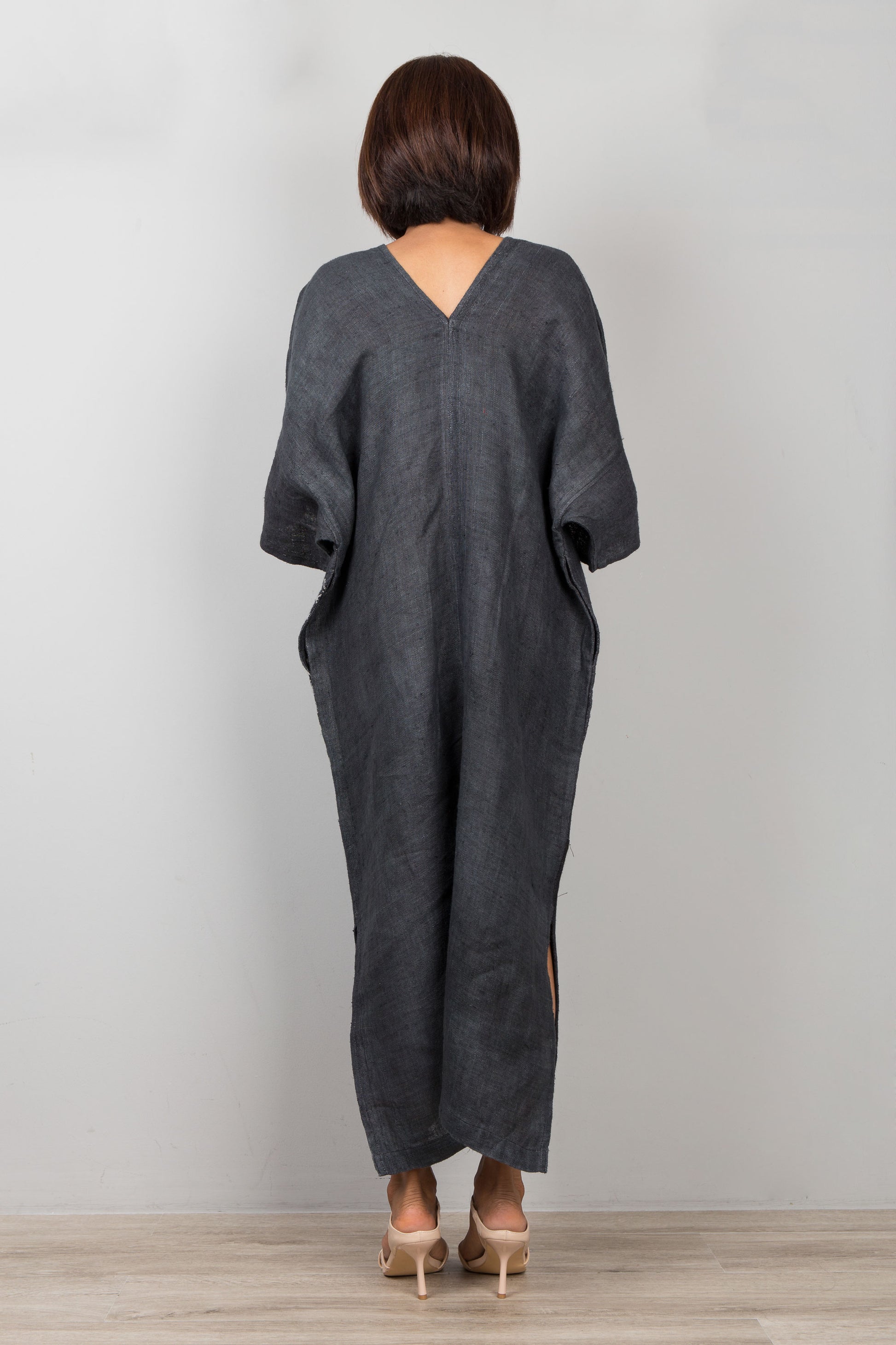 Woman wearing a black patchwork hemp caftan dress