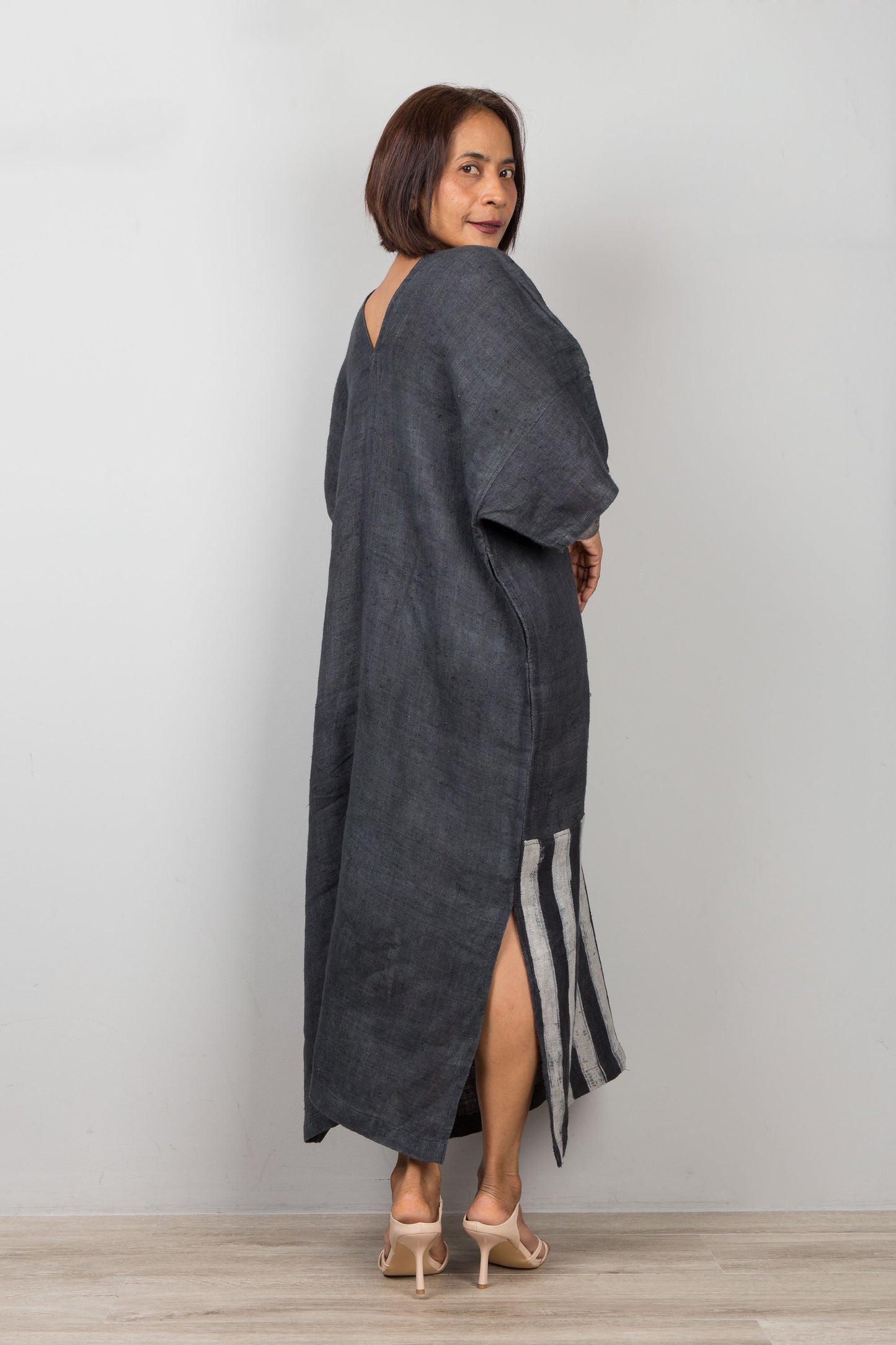 Woman wearing a black patchwork hemp caftan maxi dress