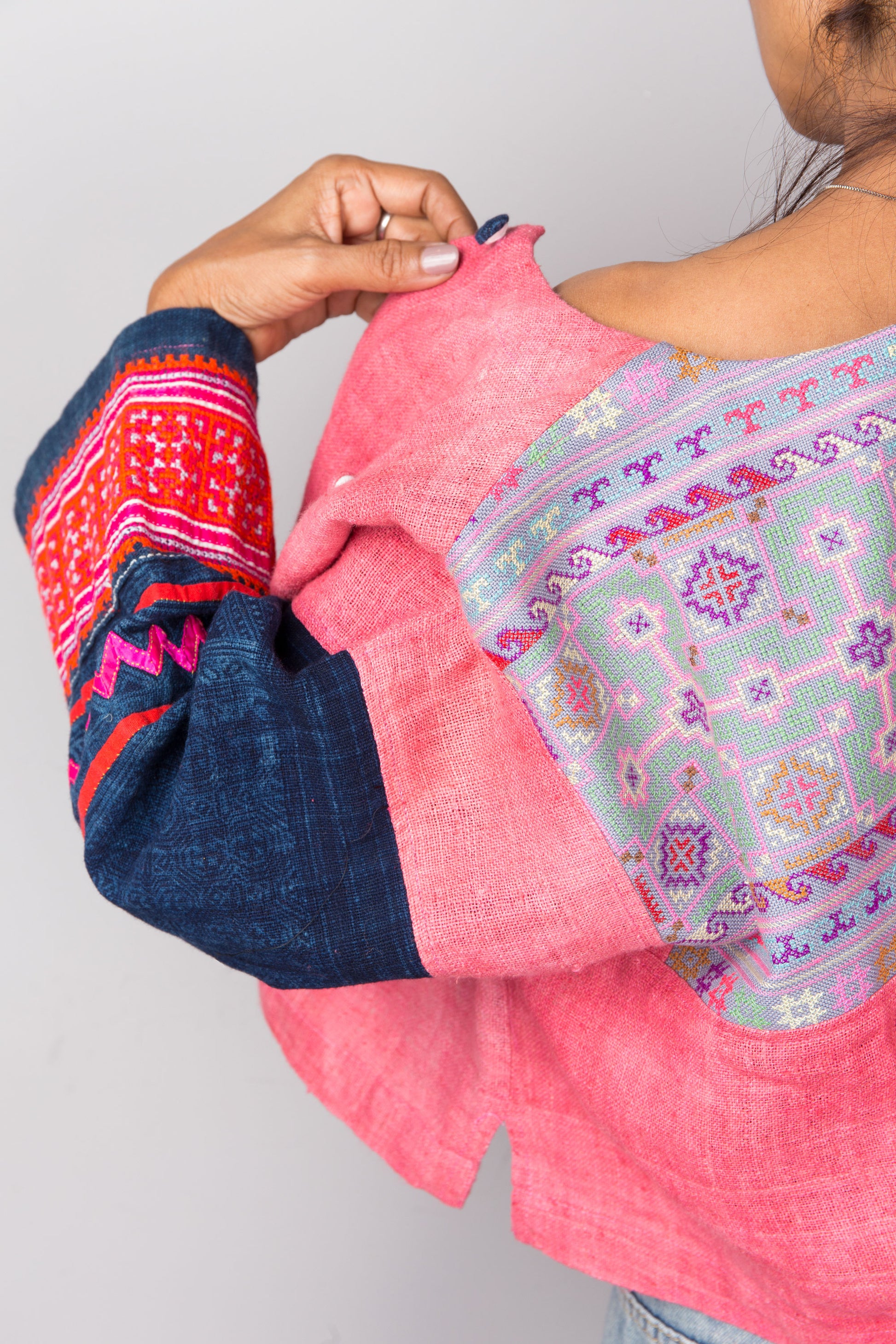 Embroidery on the back of a pink handwoven hemp jacket by Nuichan