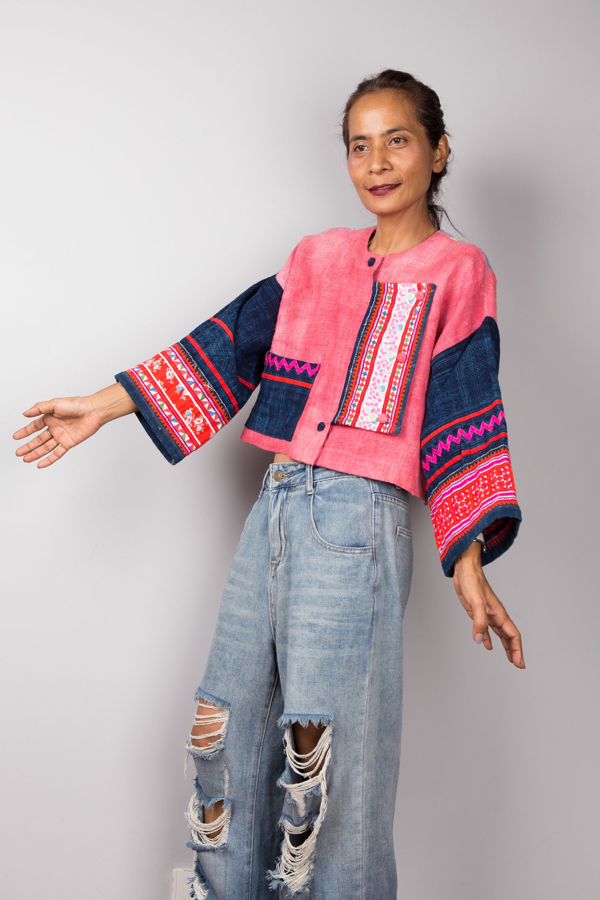 Handwoven pink hemp jacket with embroidered sleeve design. Full body view