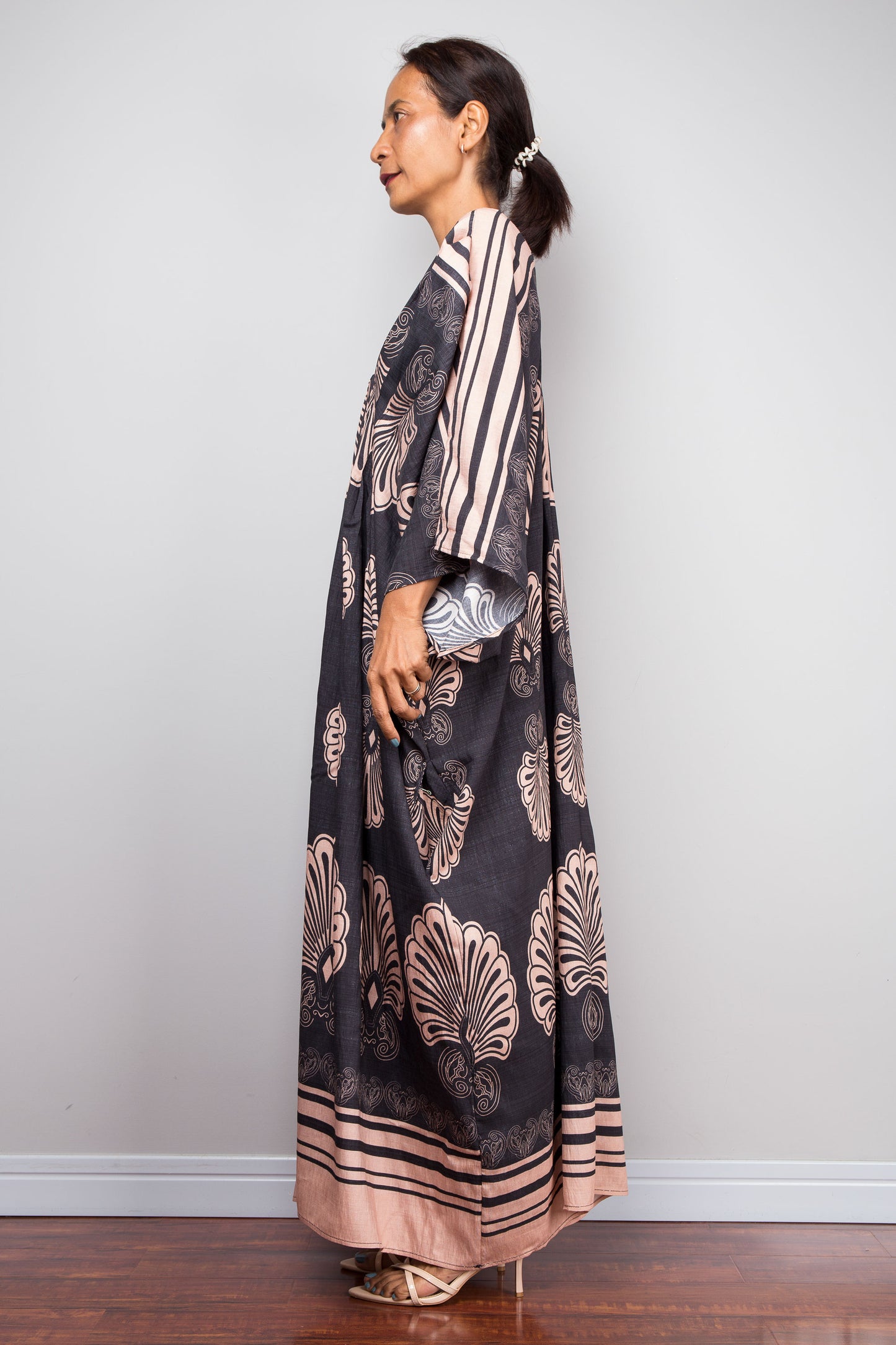 Side shot of a model in the Nuichan charcoal and blush batwing kaftan dress 