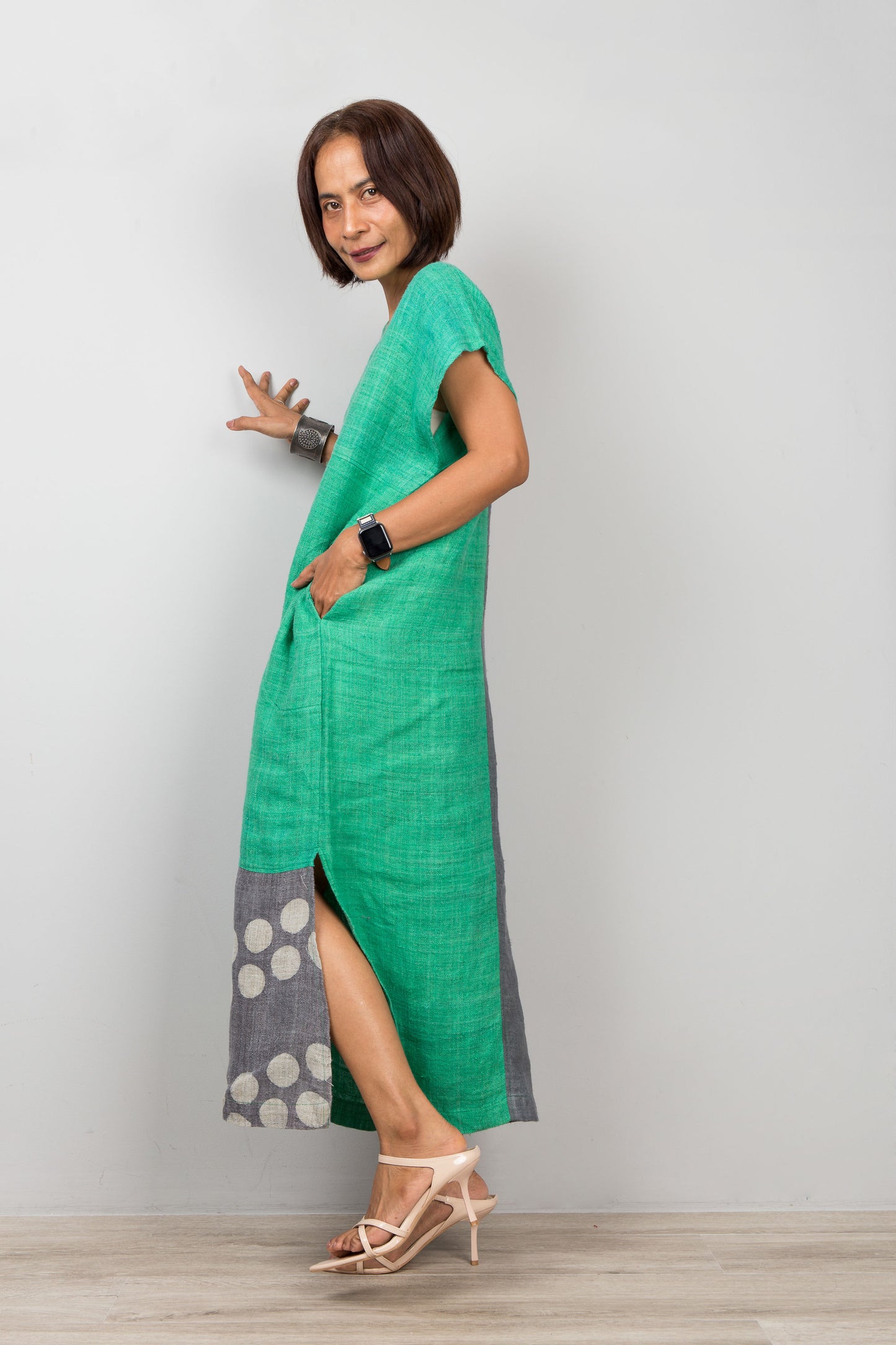 Woman wearing a two tone, handwoven hemp patchwork dress