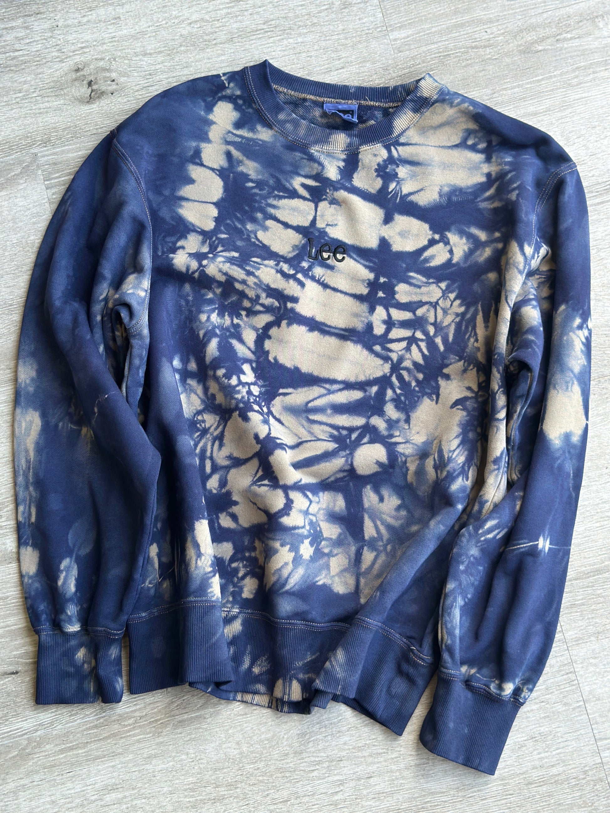 Close-up of hand-dyed indigo and beige sweatshirt.