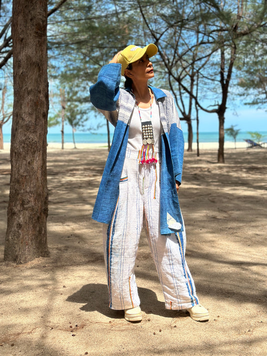Woman wearing natural indigo hill tribe open front cardigan outdoors at the beach, long sleeves, Nuichan.