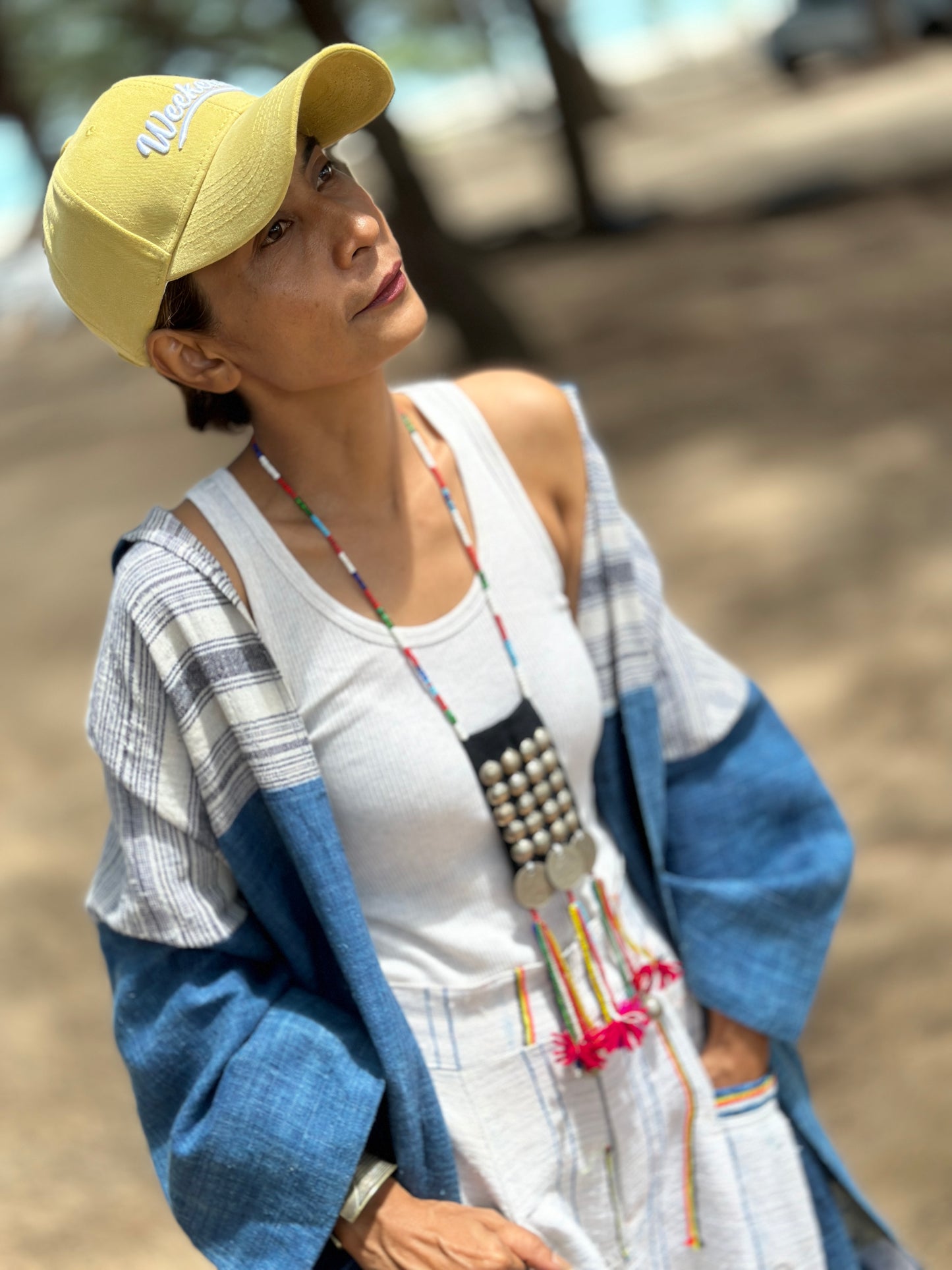 Woman wearing natural indigo hill tribe open front cardigan at the beach, Nuichan