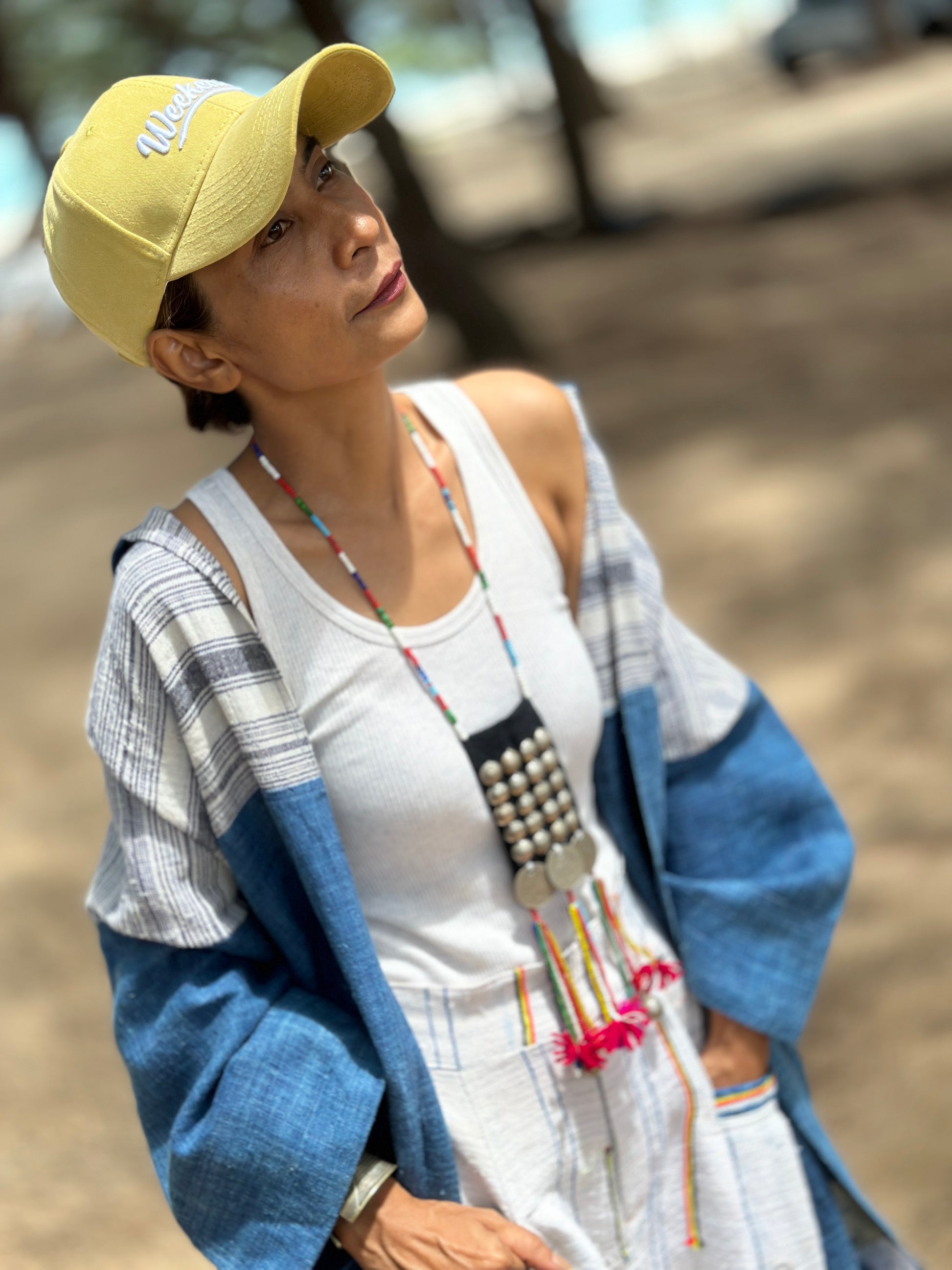 Woman wearing natural indigo hill tribe open front cardigan at the beach, Nuichan