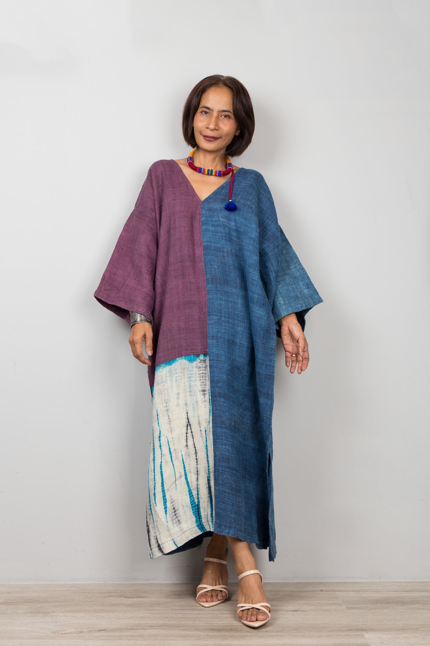 Nuichan wearing an Indigo hemp patchwork caftan dress with wide sleeves and ankle-length hem