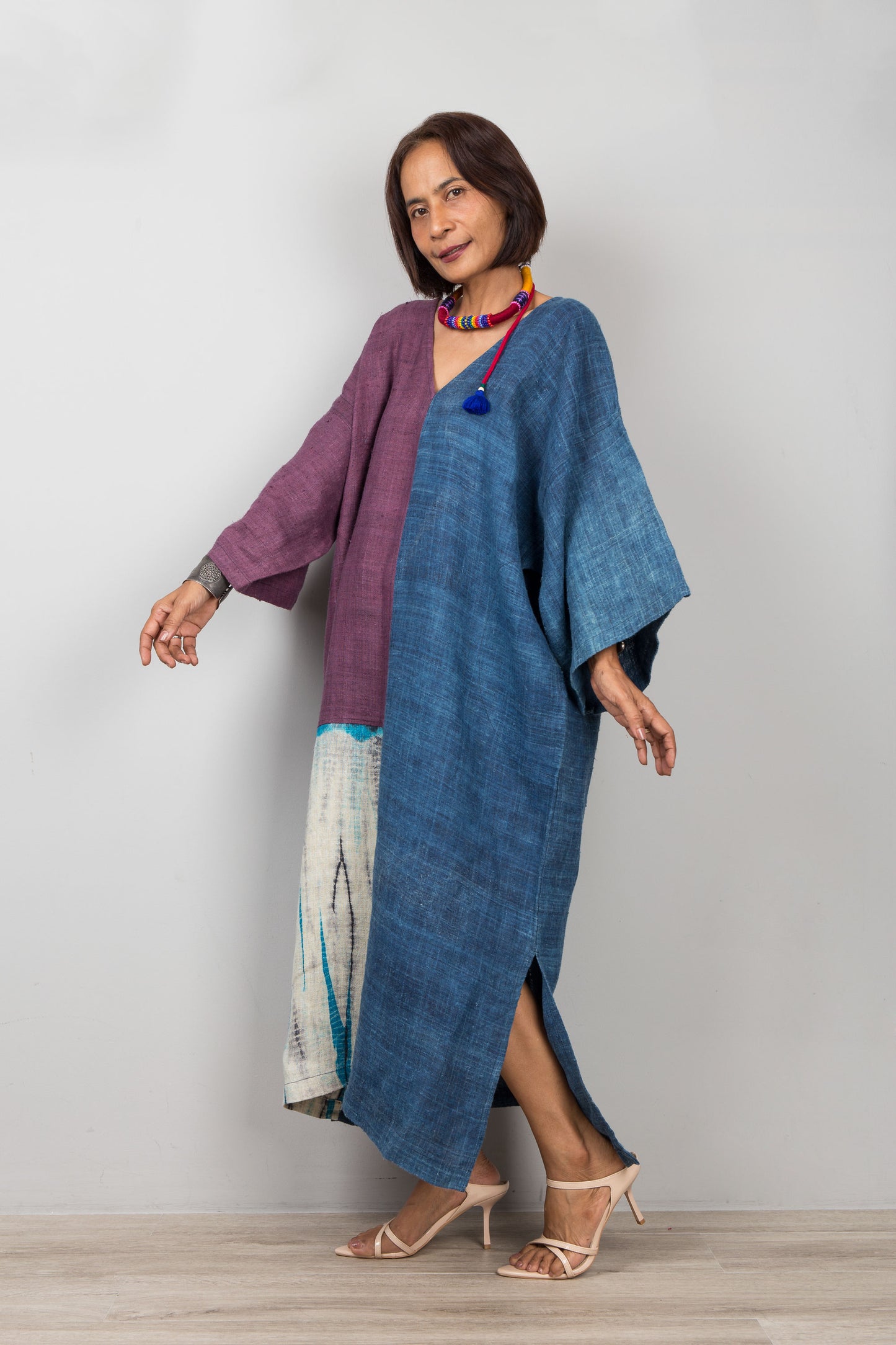 Side view of sustainable hemp kaftan dress highlighting relaxed fit and side slit