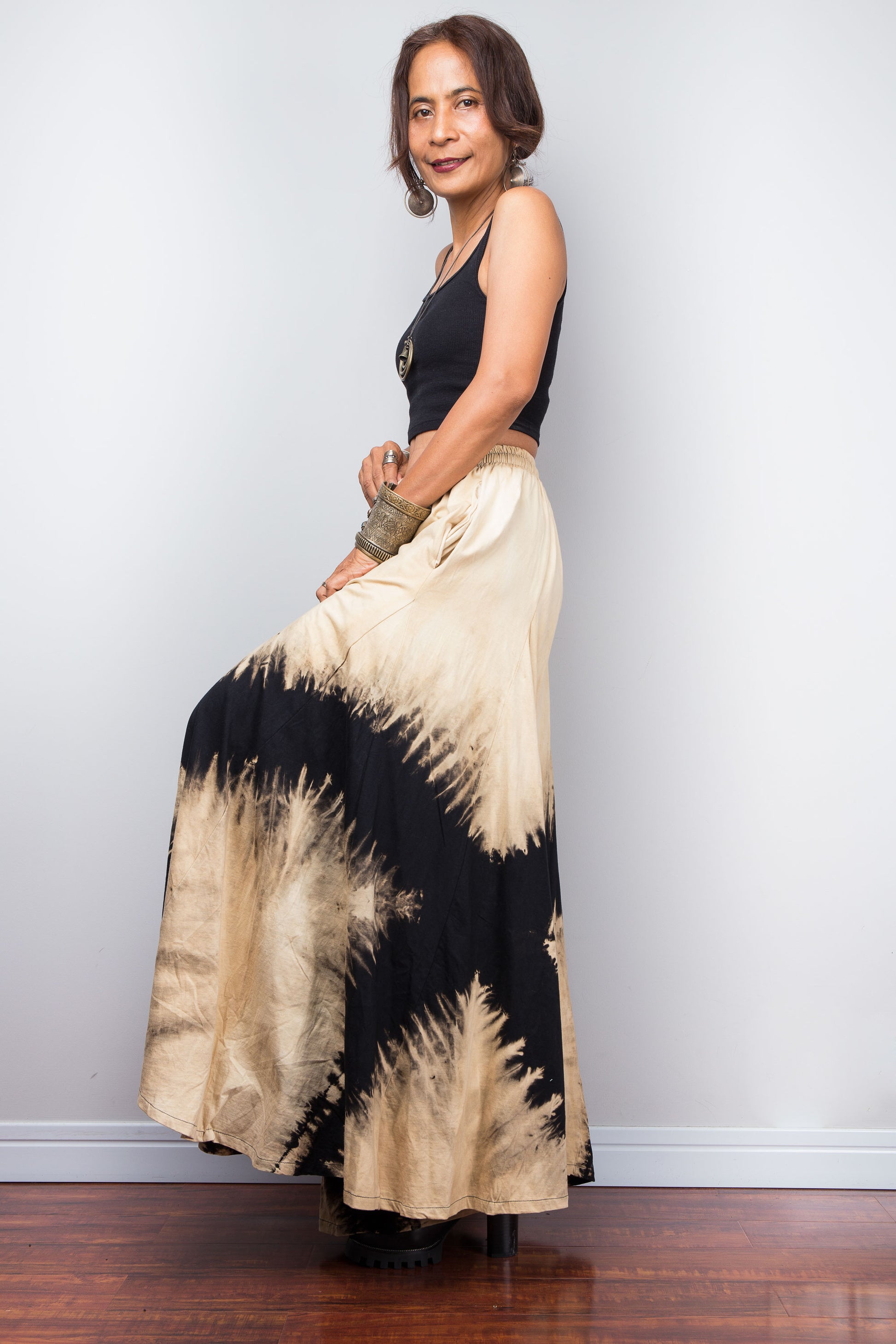 Side view of the Nuichan black and sand bleach tie dye lounge wide leg pants
