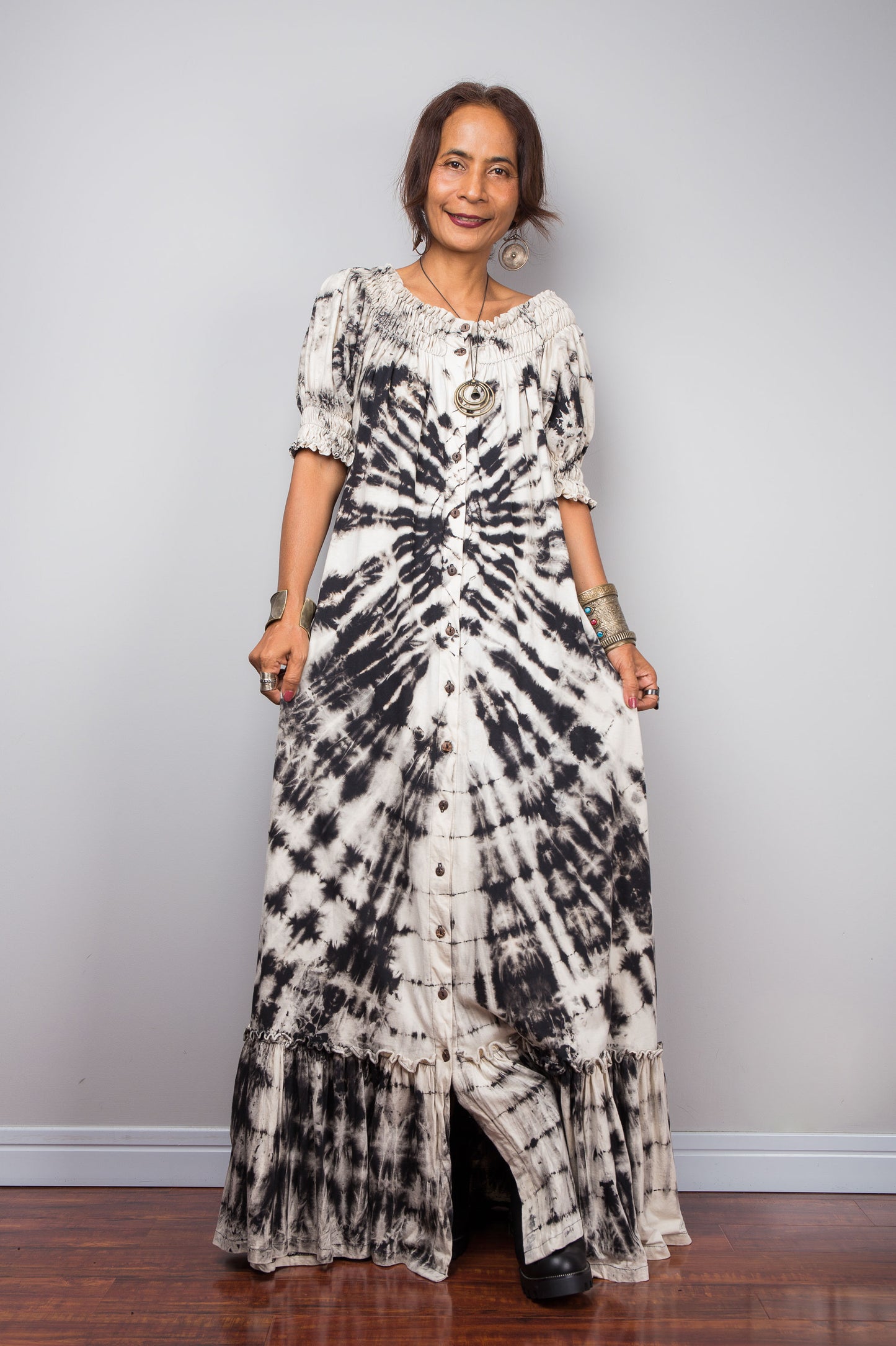 Model wearing the Nuichan bohemian long shirt dress with the smocked neckline styled as a scoop neck, emphasizing the functional front buttons and side pockets.