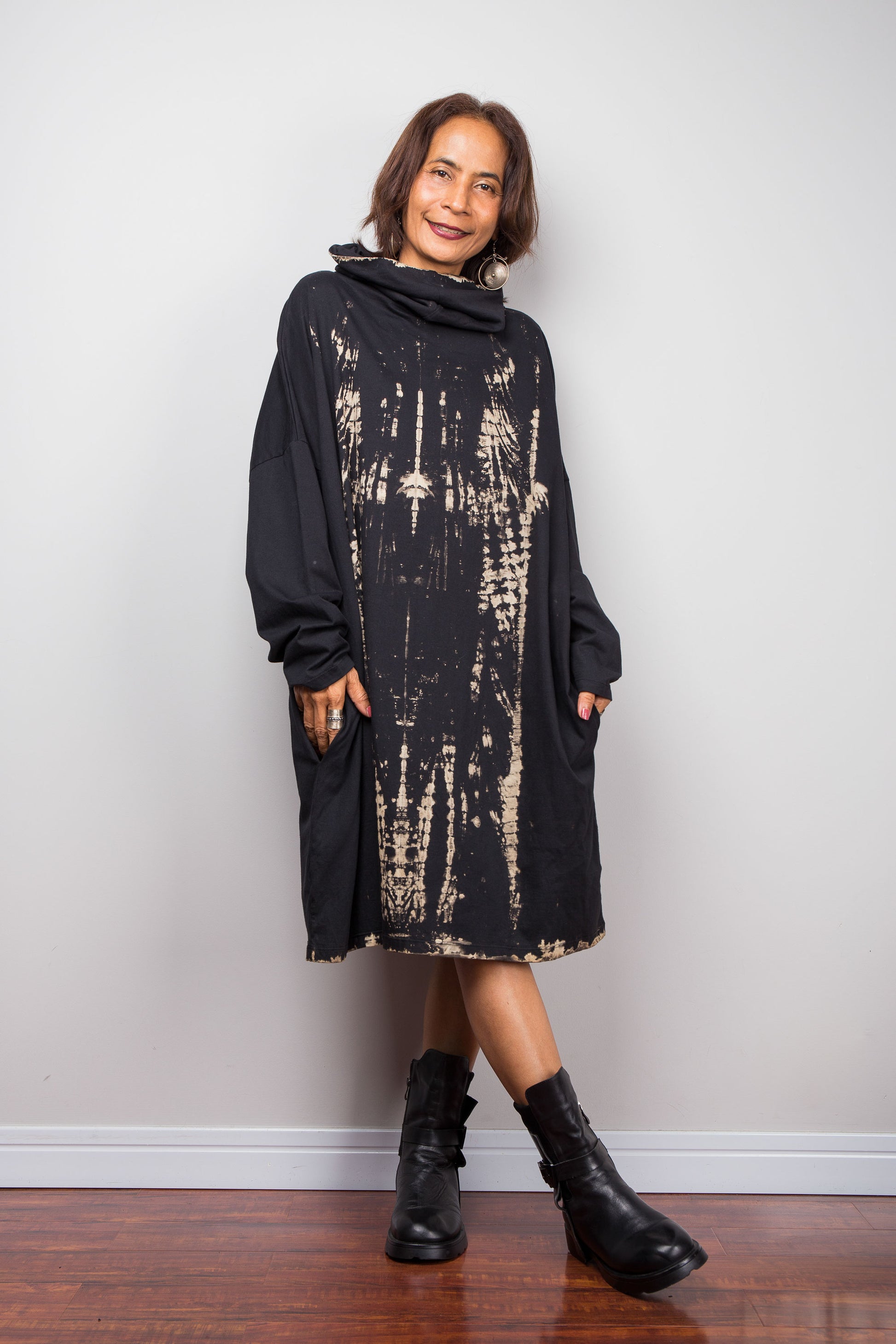 Oversized Nuichan reverse tie dye tunic dress featuring a cowl neck and vertical abstract sand and black patterns.  Front view.