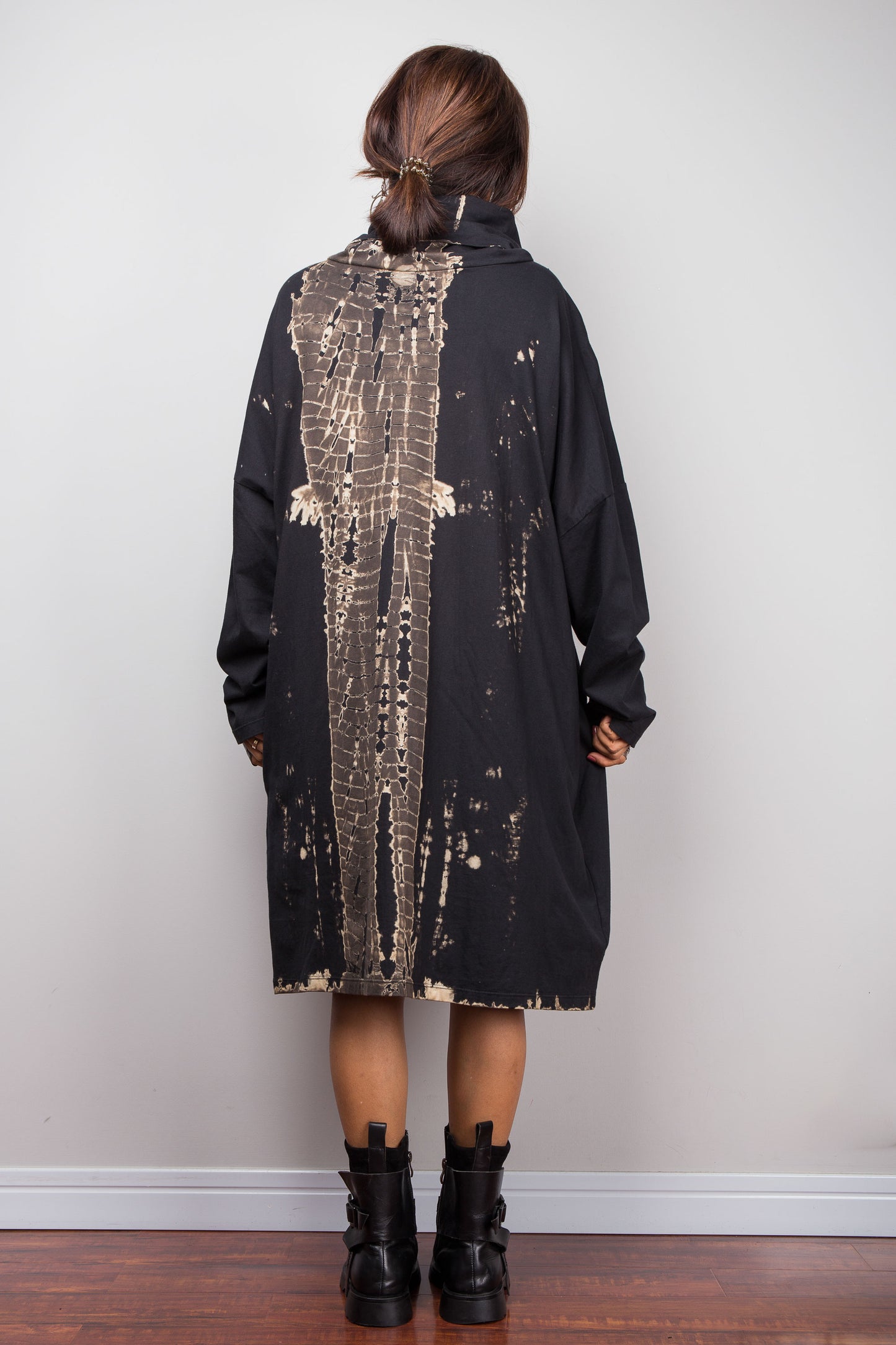 Oversized Nuichan reverse tie dye tunic dress featuring a cowl neck and vertical abstract sand and black patterns.  Back view