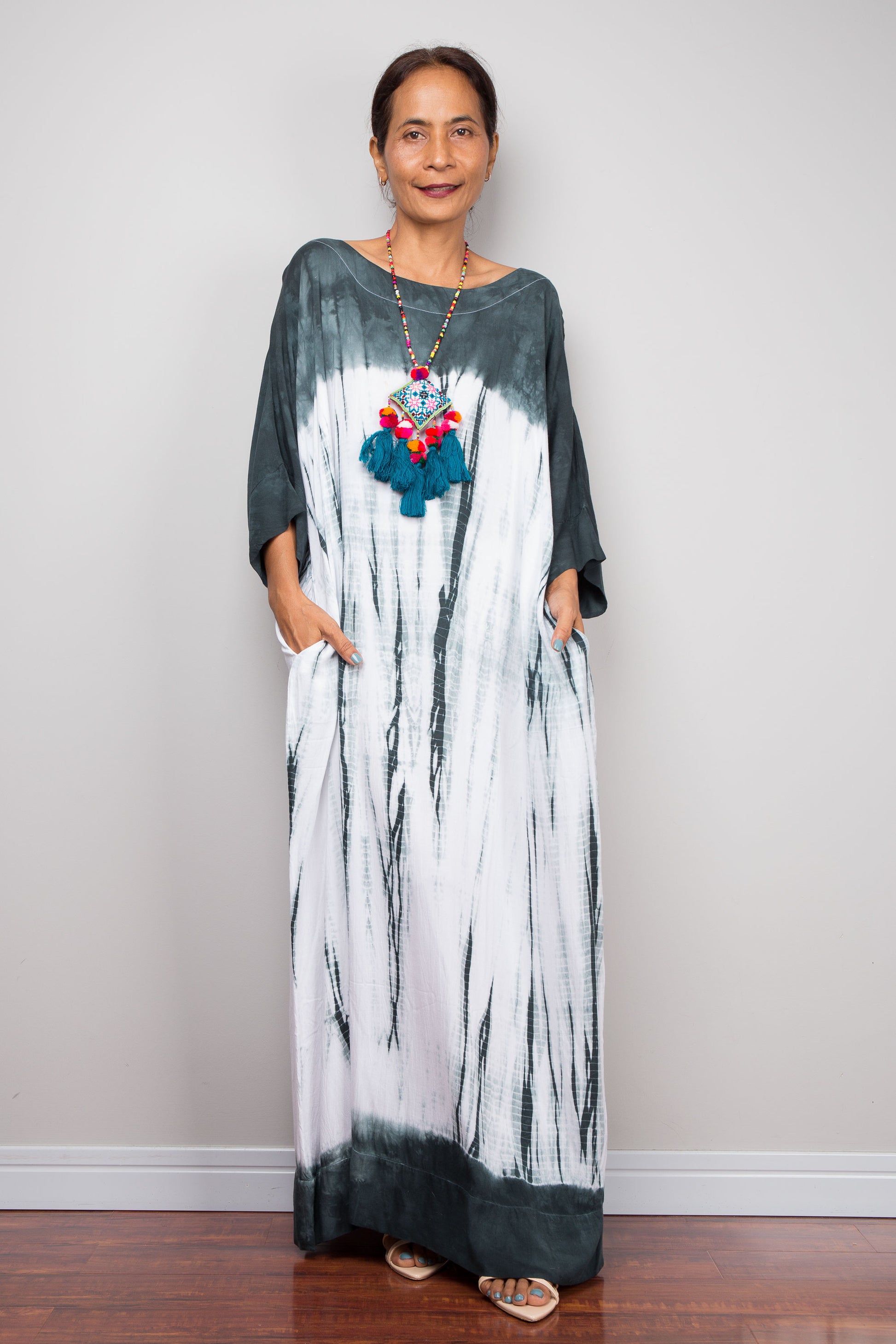 Front full-length view of the relaxed fit rayon spandex Shibori tie dye summer dress by Nuichan, displaying its fluid drape and classic boat neckline.