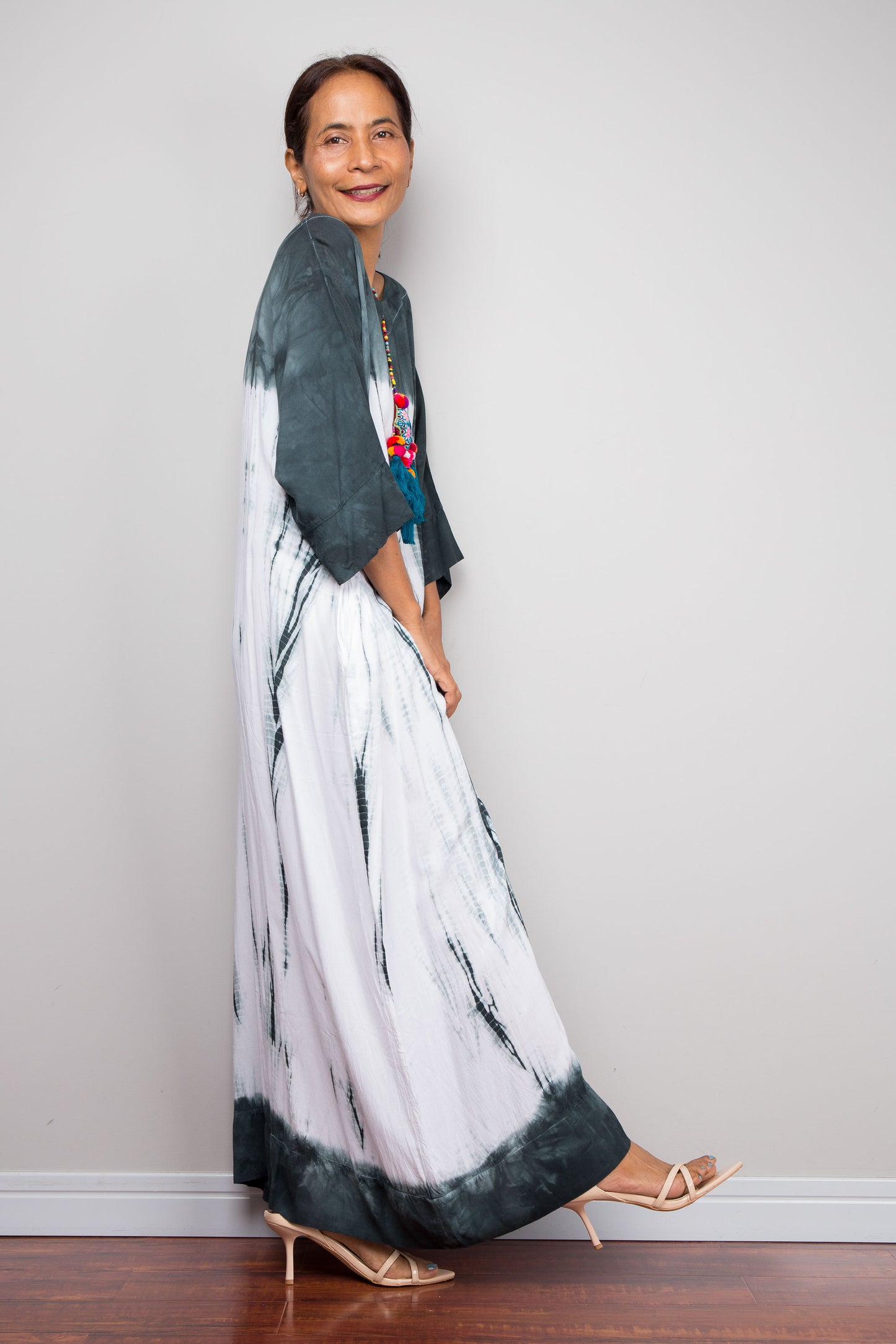 Side view of the relaxed fit rayon cotton Shibori tie dye summer dress by Nuichan, displaying its fluid drape and classic boat neckline.