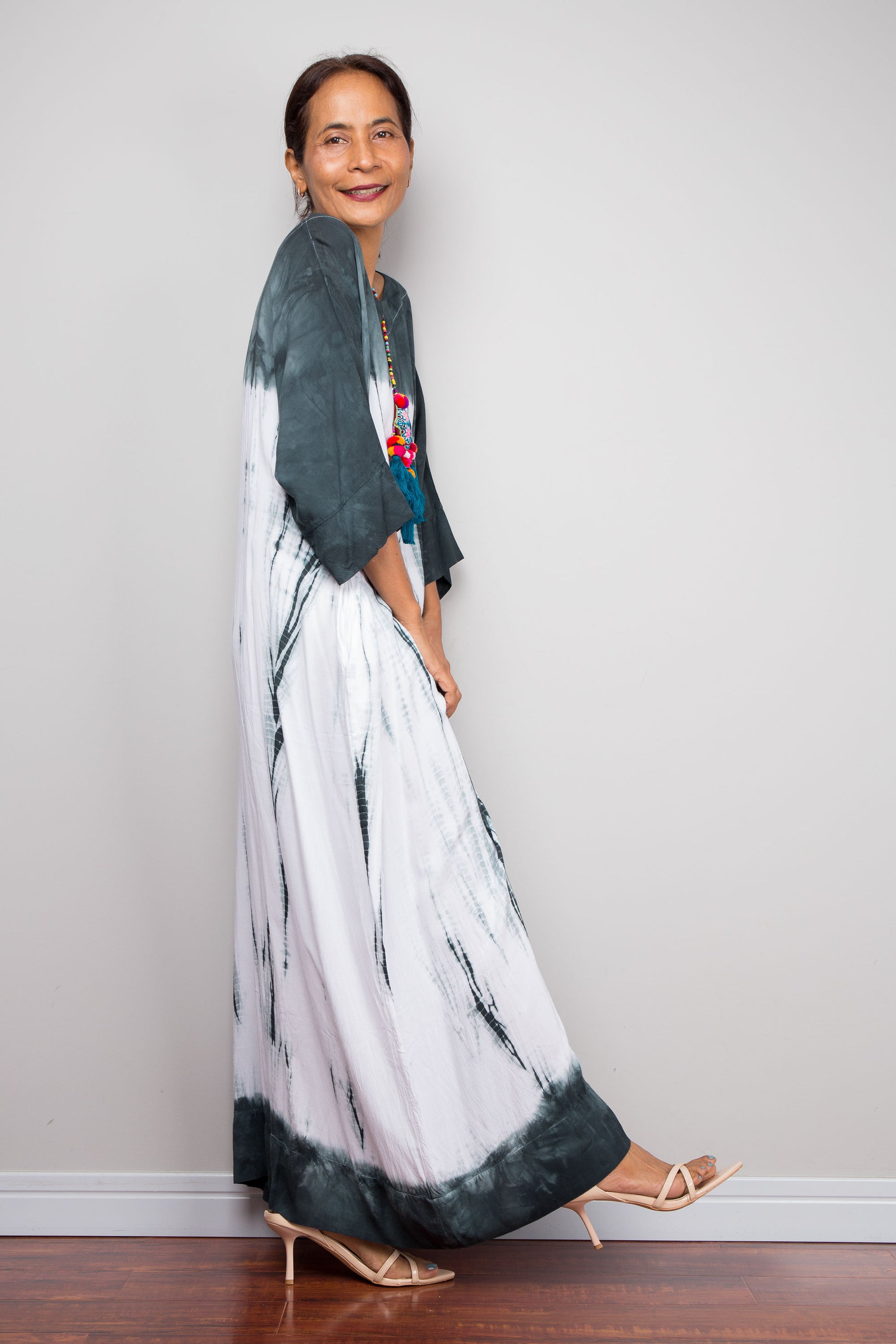 Side view of the relaxed fit rayon cotton Shibori tie dye summer dress by Nuichan, displaying its fluid drape and classic boat neckline.